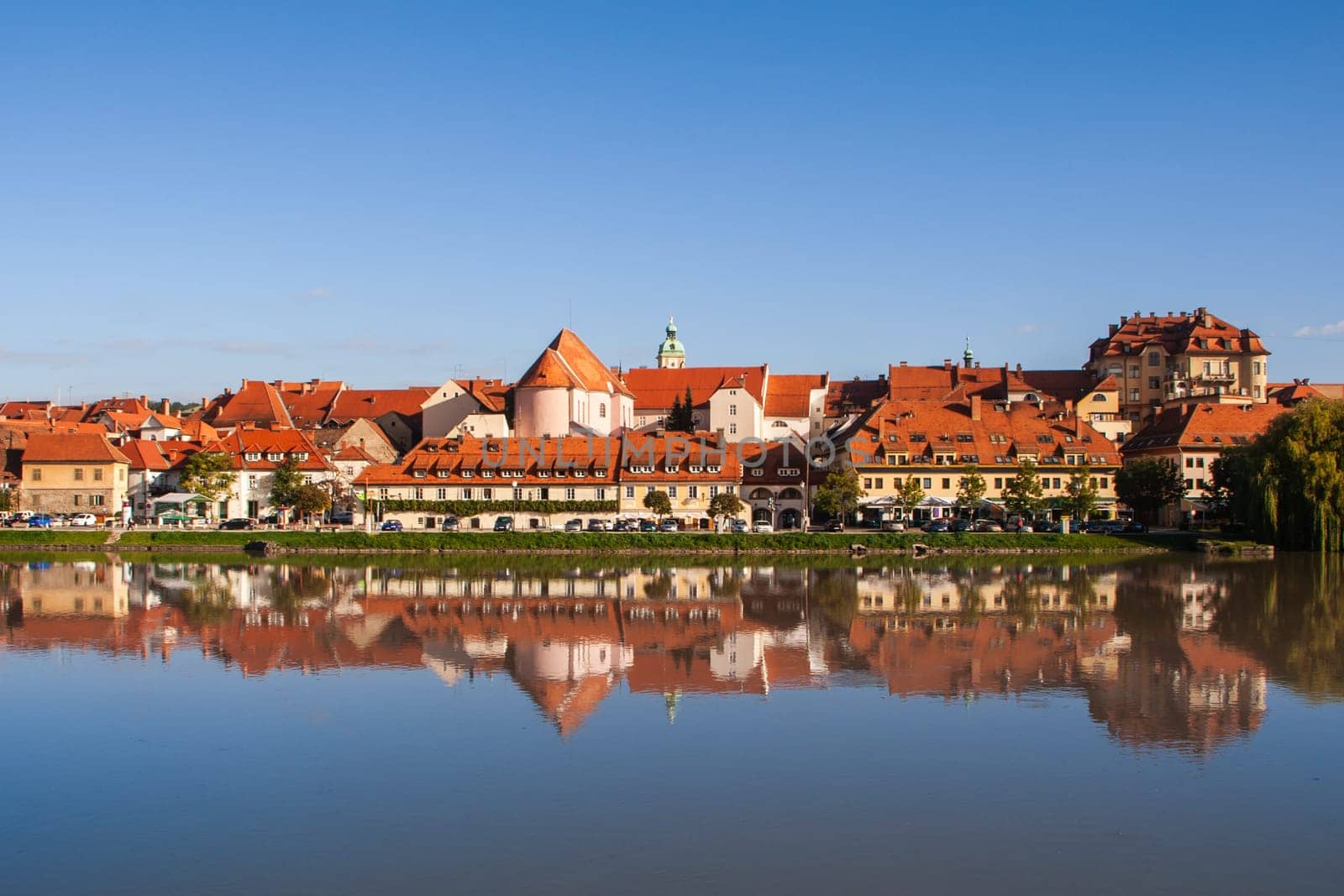 Lent district in Maribor, Slovenia. Popular waterfront promenade with historical buildings and the oldest grape vine in Europe