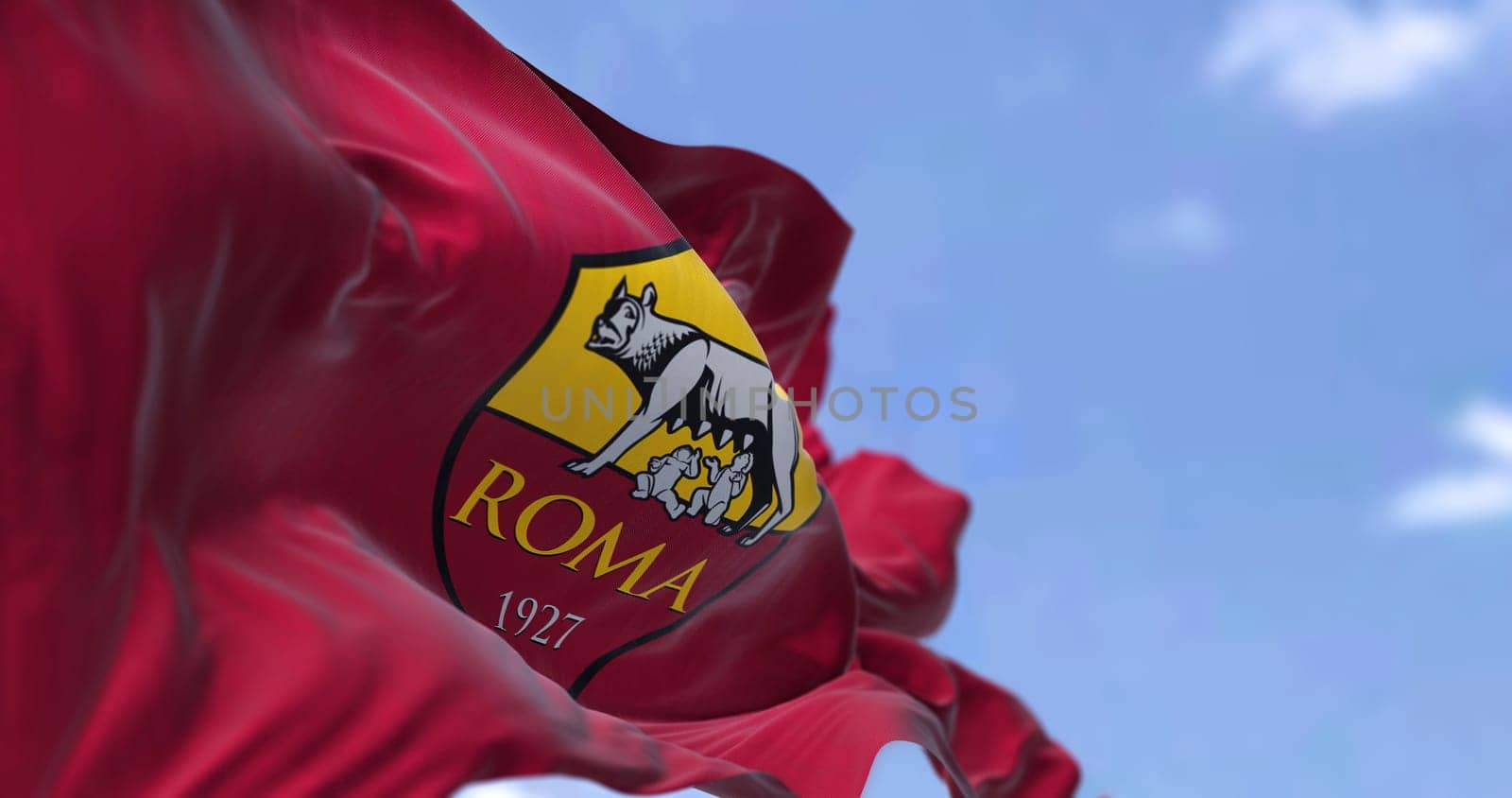 Rome, Italy, July 2022: The flag of AS Roma waving. AS Roma is a professional football club based in Rome. Fabric textured background