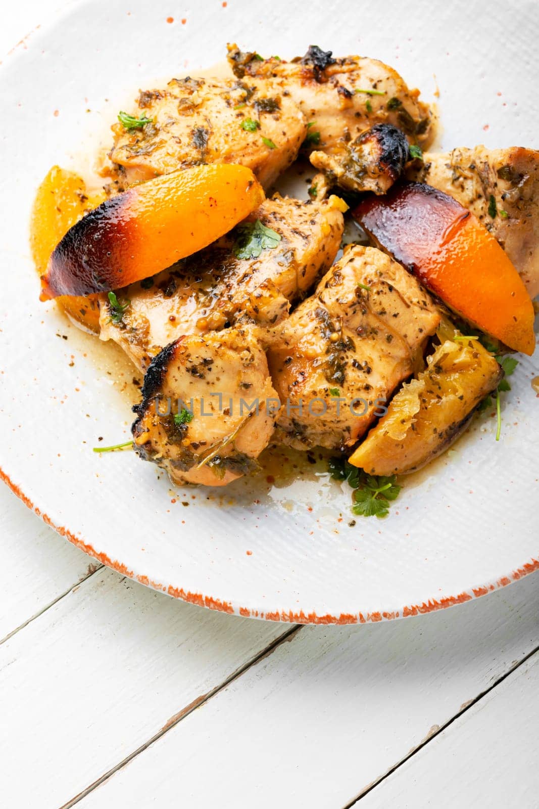 Chicken breast baked in orange sauce. Food for Christmas.