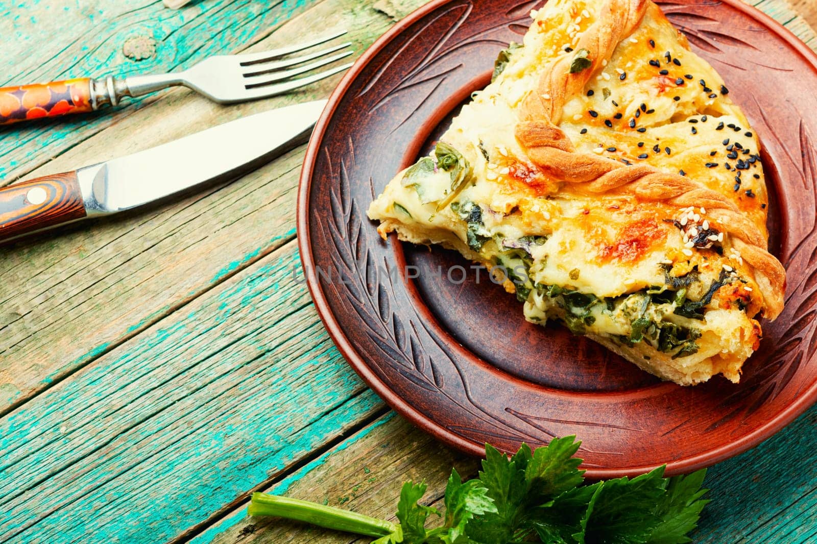 Homemade pie with cheese and herbs. Pie with soft cheese filling.