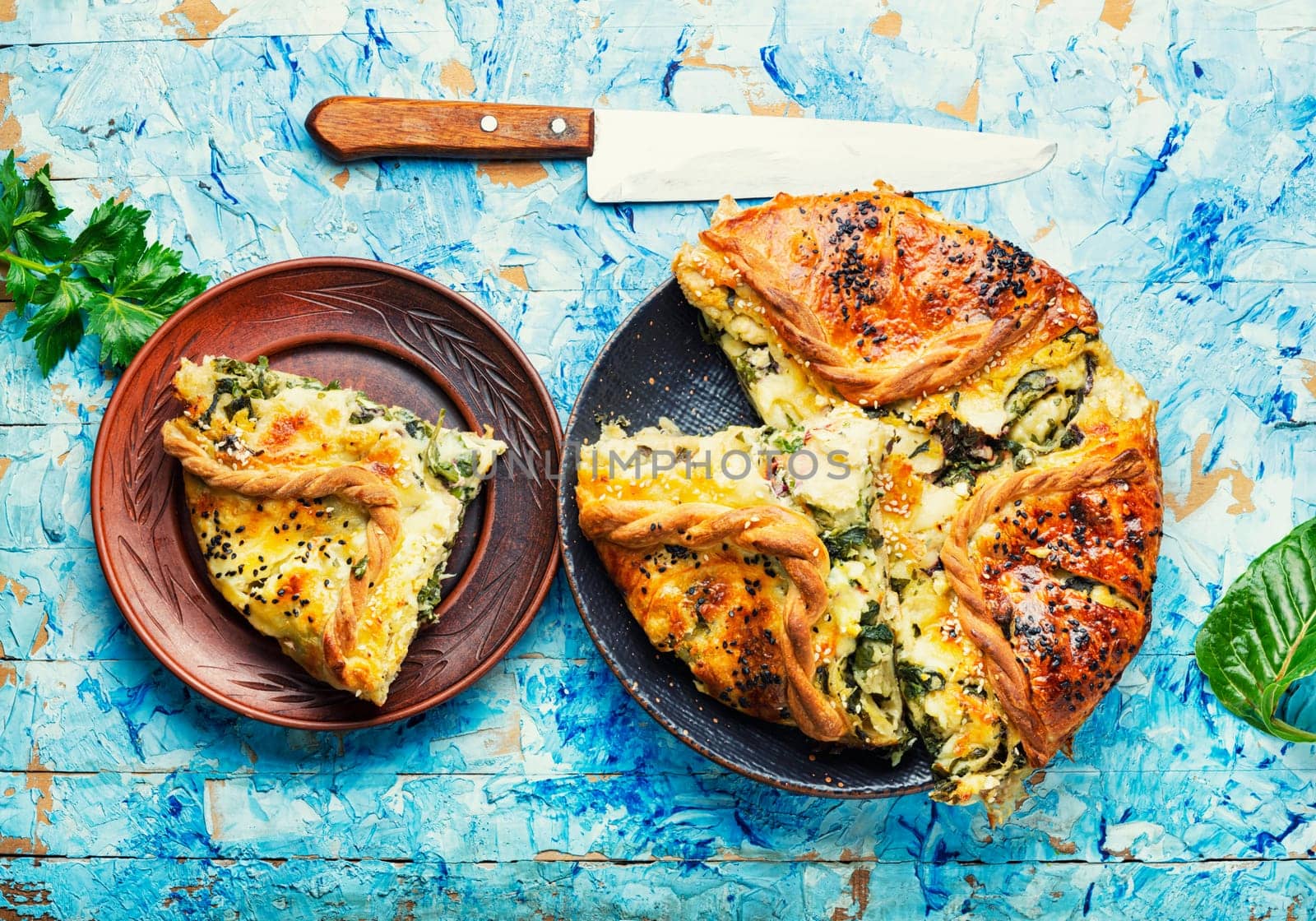 Homemade pie with cheese and herbs. Pie with soft cheese filling.