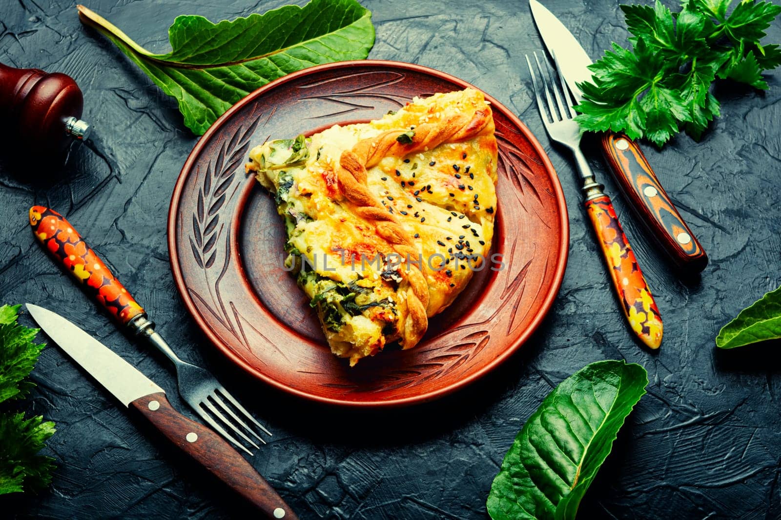 Homemade pie with cheese and herbs. Pie with soft cheese filling.