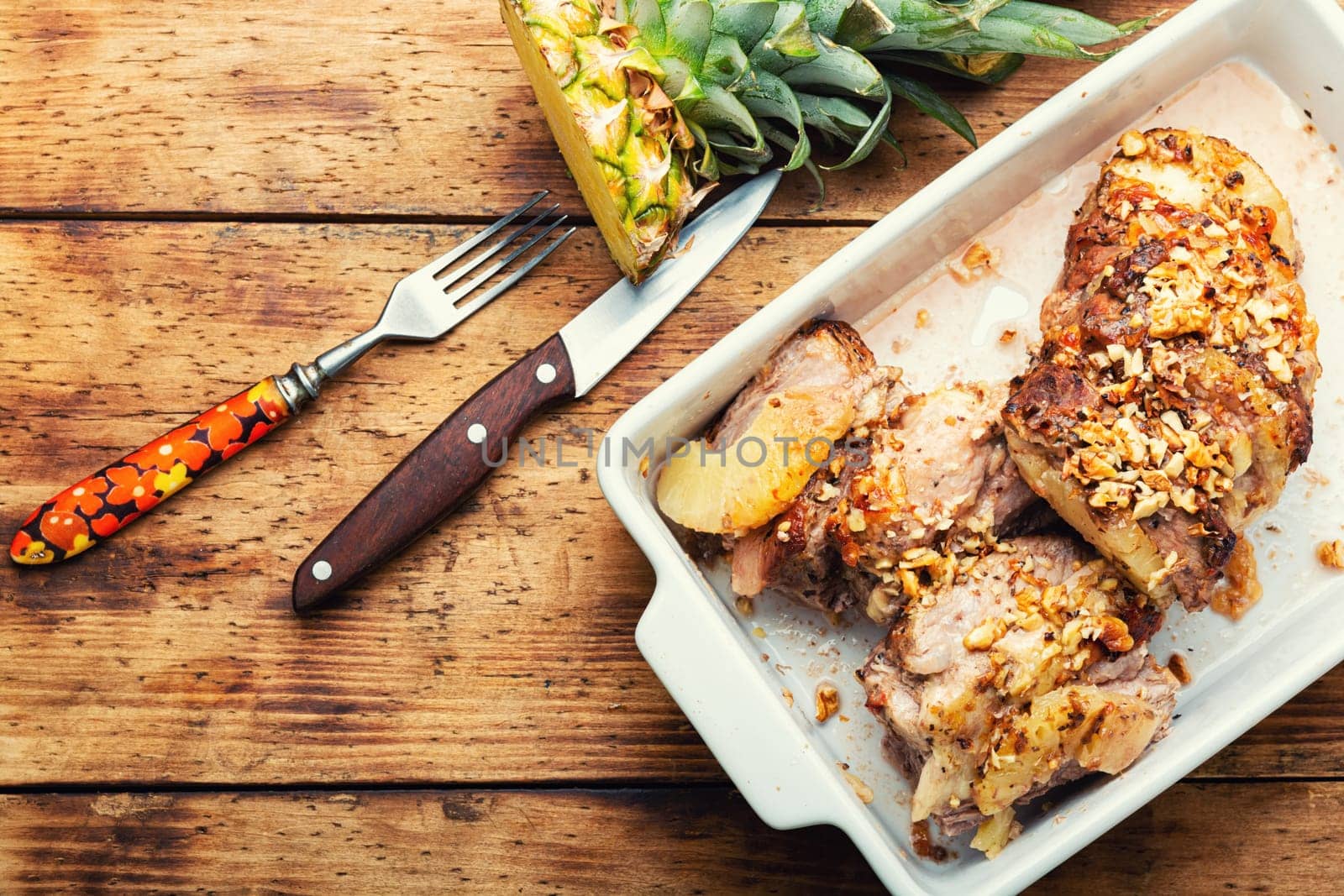 Pork meat baked with pineapple and cheese