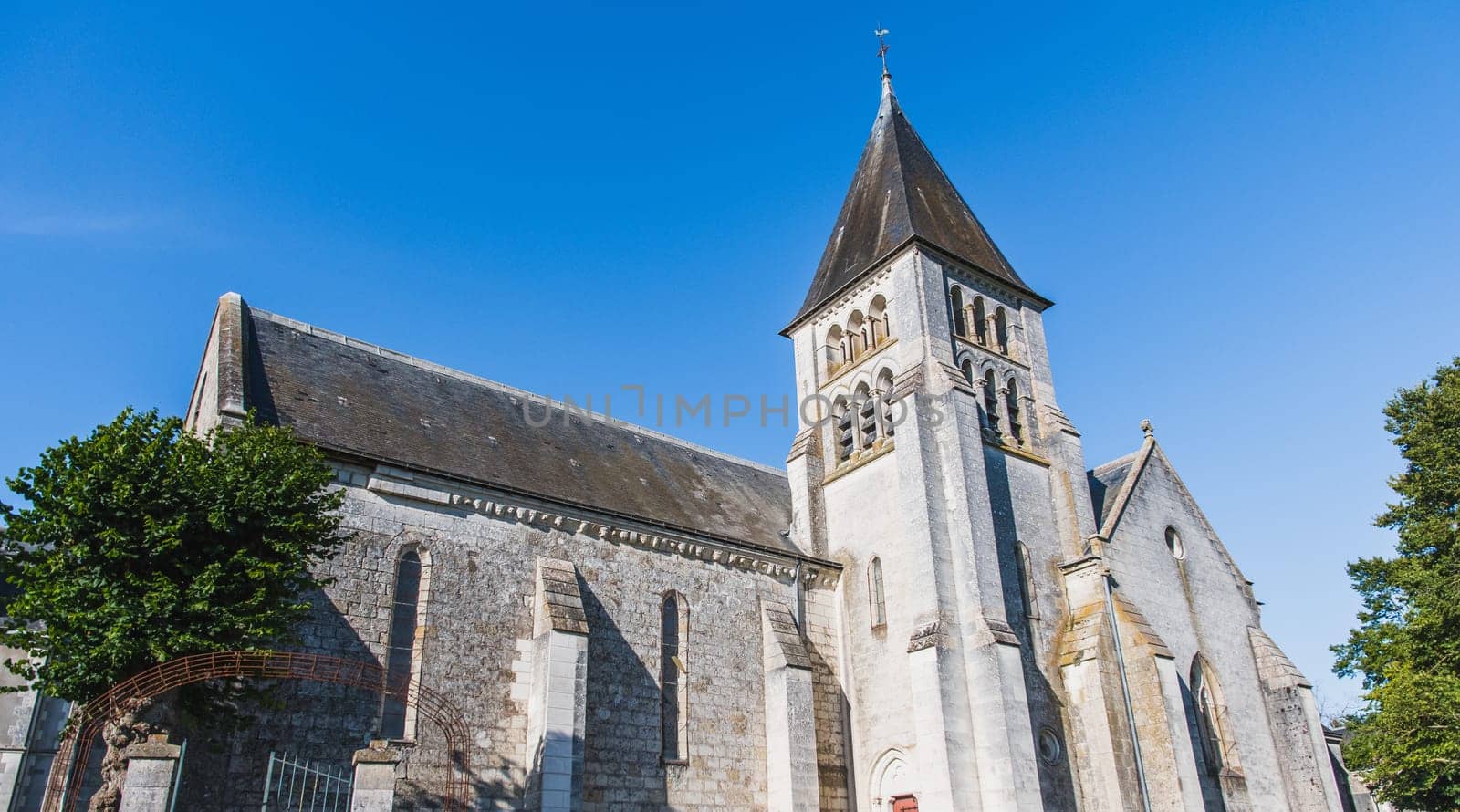 Church of Saint Hilaire de Châteauvieux under a blue sky in Châteauvieux in the Loir-et-Cher