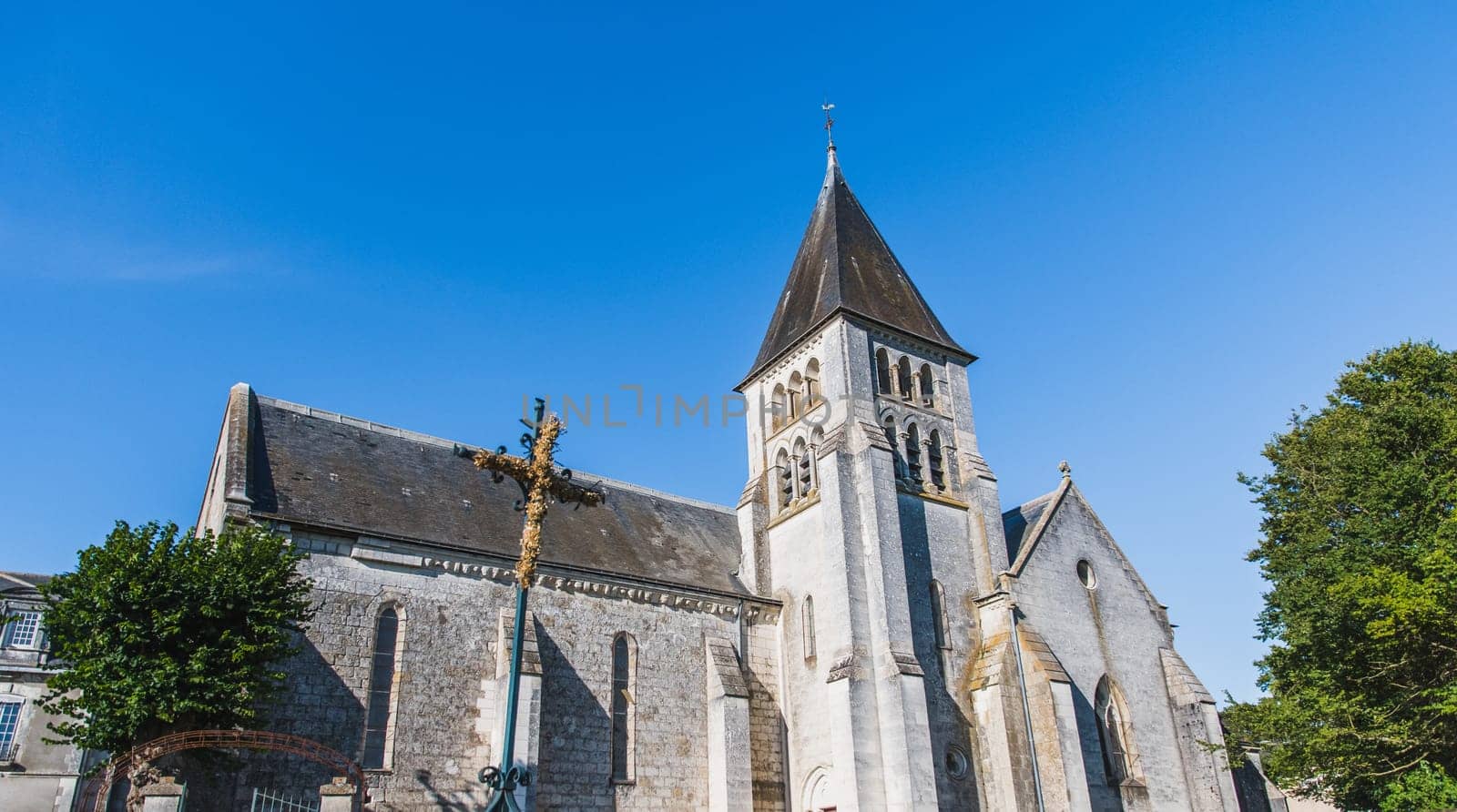 Church of Saint Hilaire de Châteauvieux under a blue sky in Châteauvieux in the Loir-et-Cher