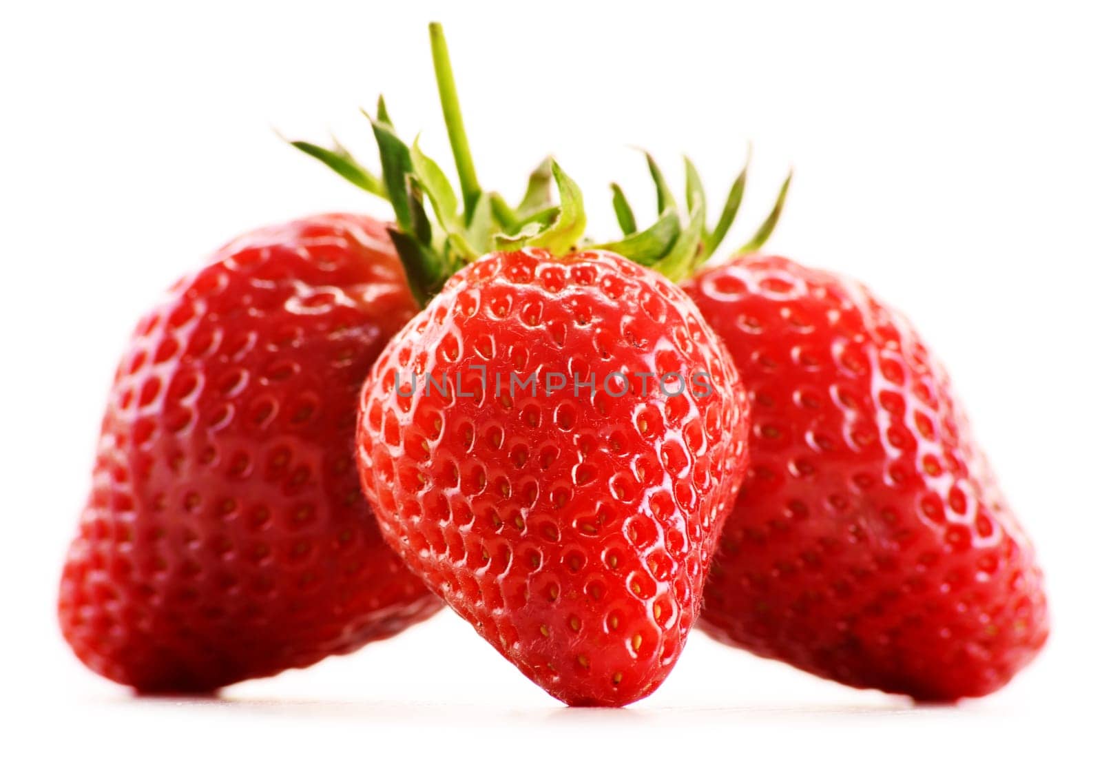 Fresh organic strawberries isolated on white background.