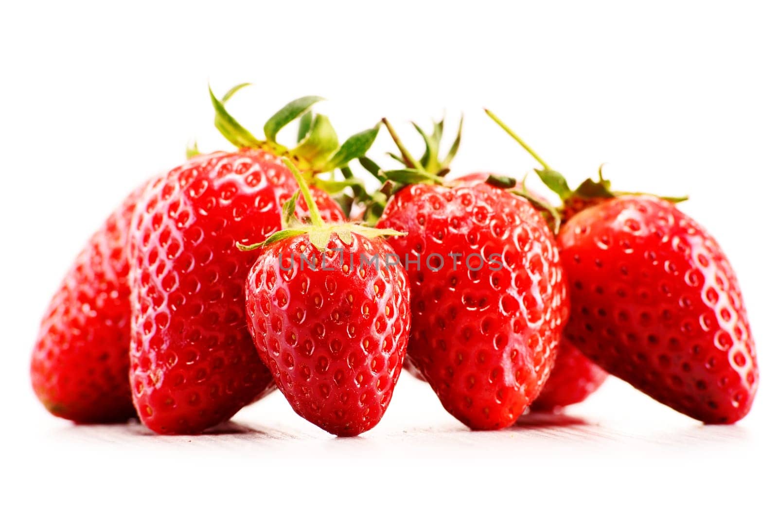 Fresh organic strawberries isolated on white background.