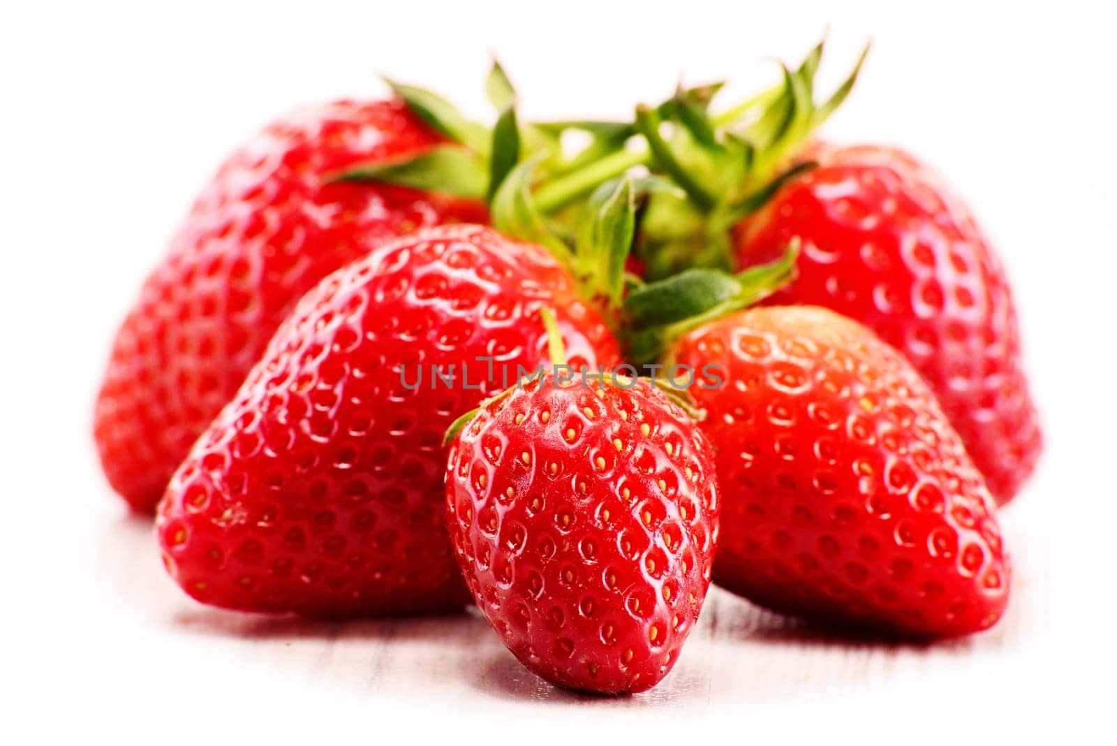 Fresh organic strawberries isolated on white background.