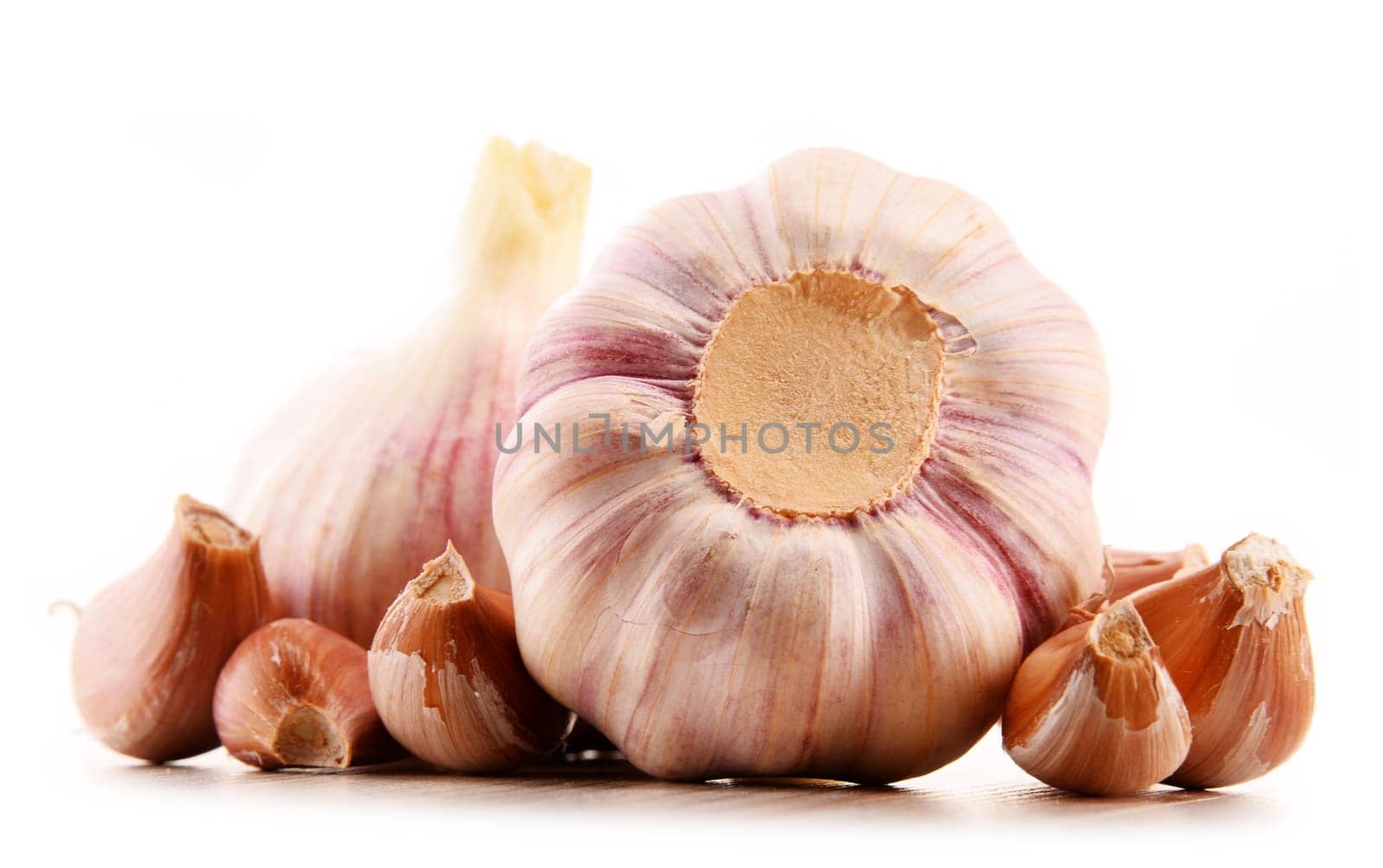 Composition with bulbs of garlic isolated on white background