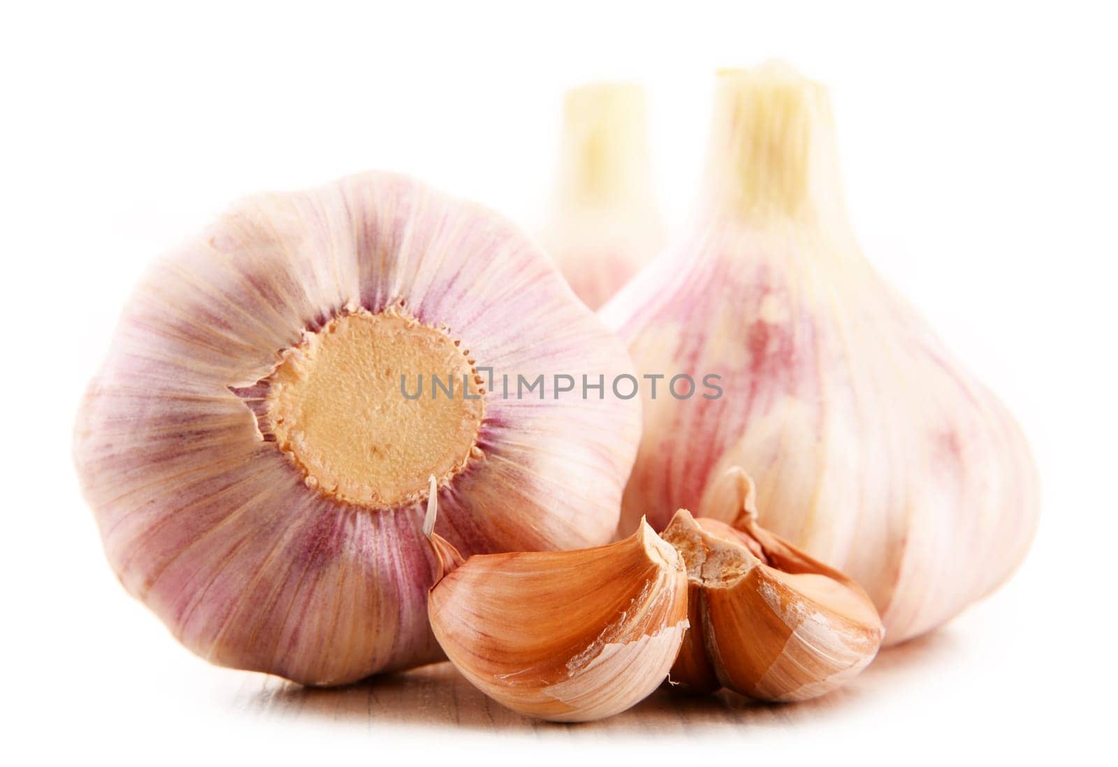 Composition with bulbs of garlic isolated on white background