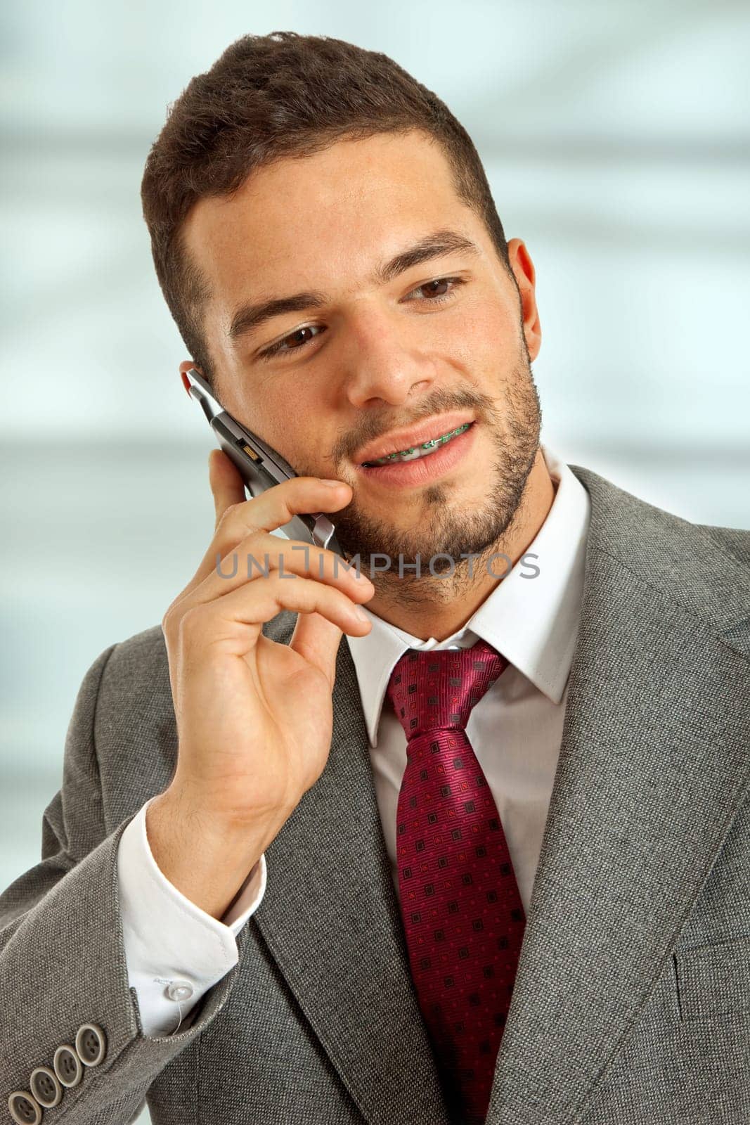 young happy business man on the phone
