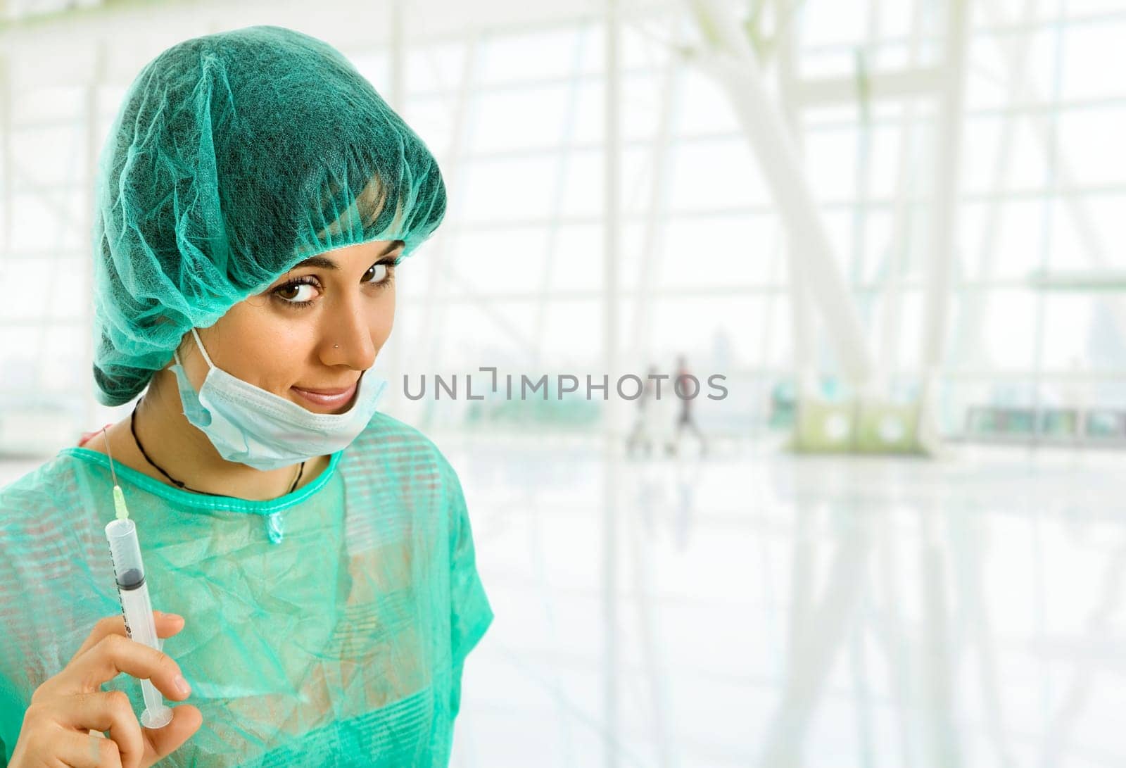 young woman nurse portrait with a syringe