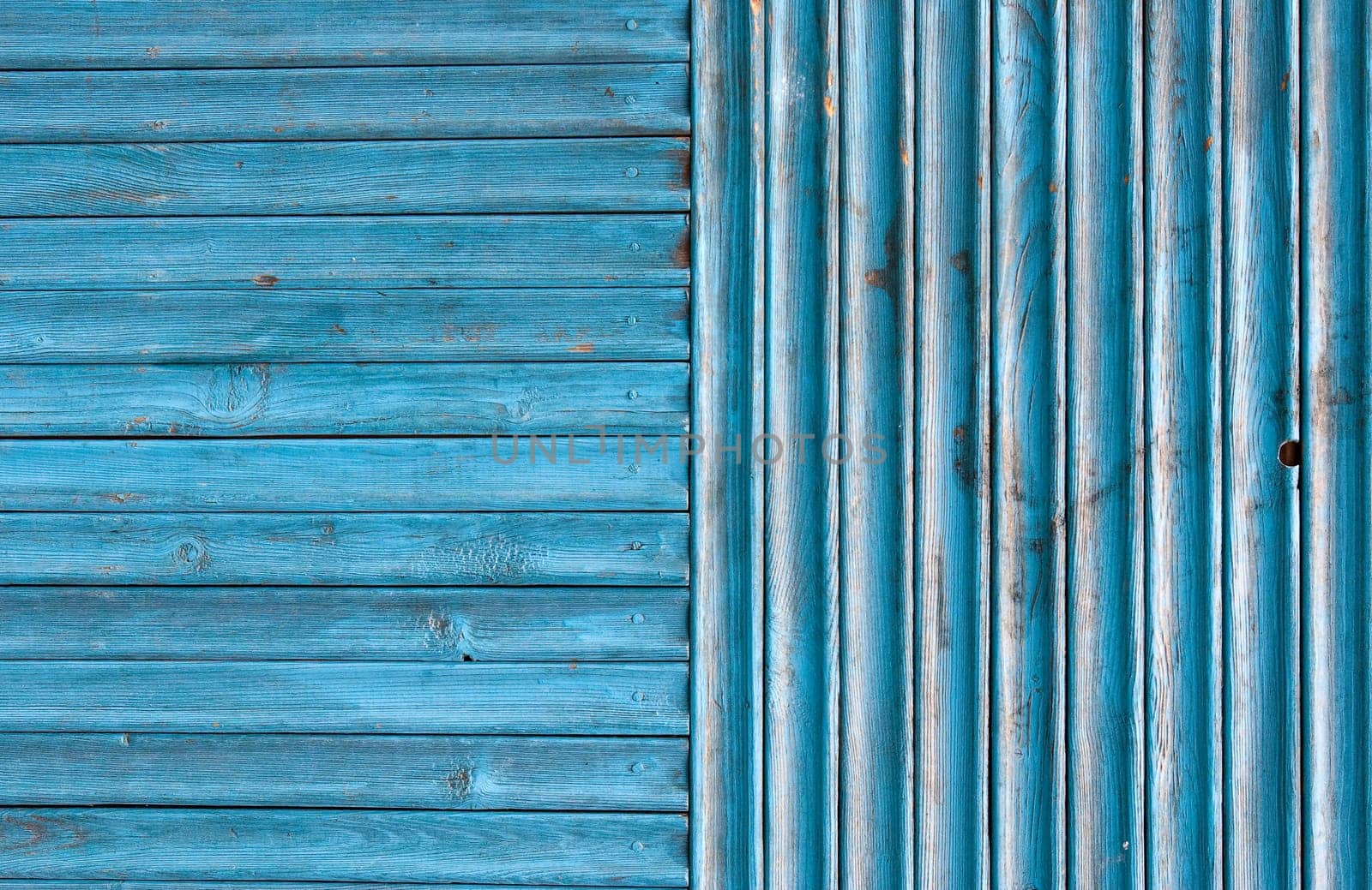 Dirty, stained by a paint the hammered together fence