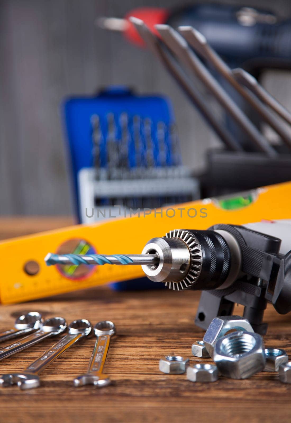 Set of different tools on wooden background