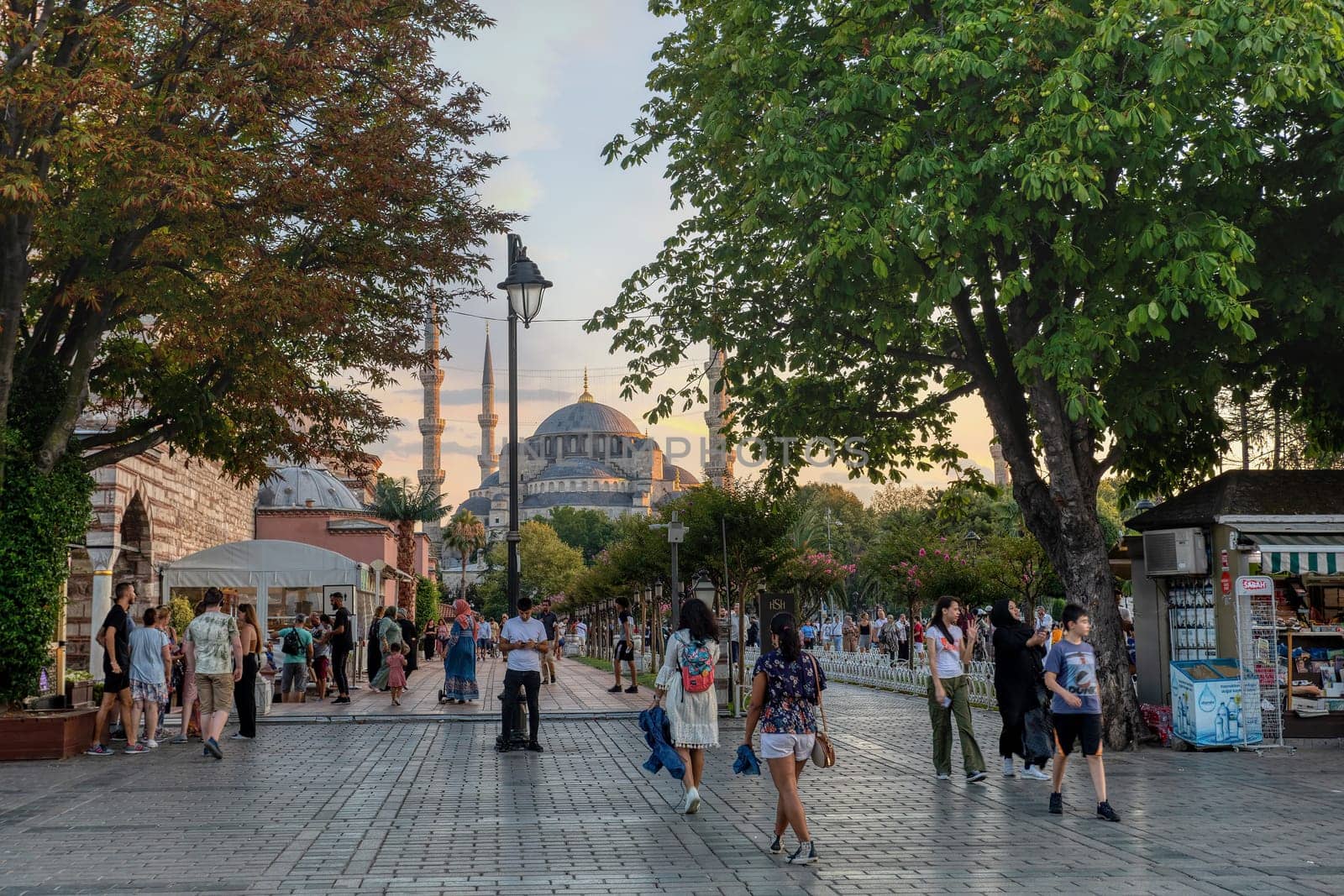 Istanbul, Turkey - August 5, 2022: View of people resting in Sultan Ahmed Blue Mosque park Istanbul, Turkey
