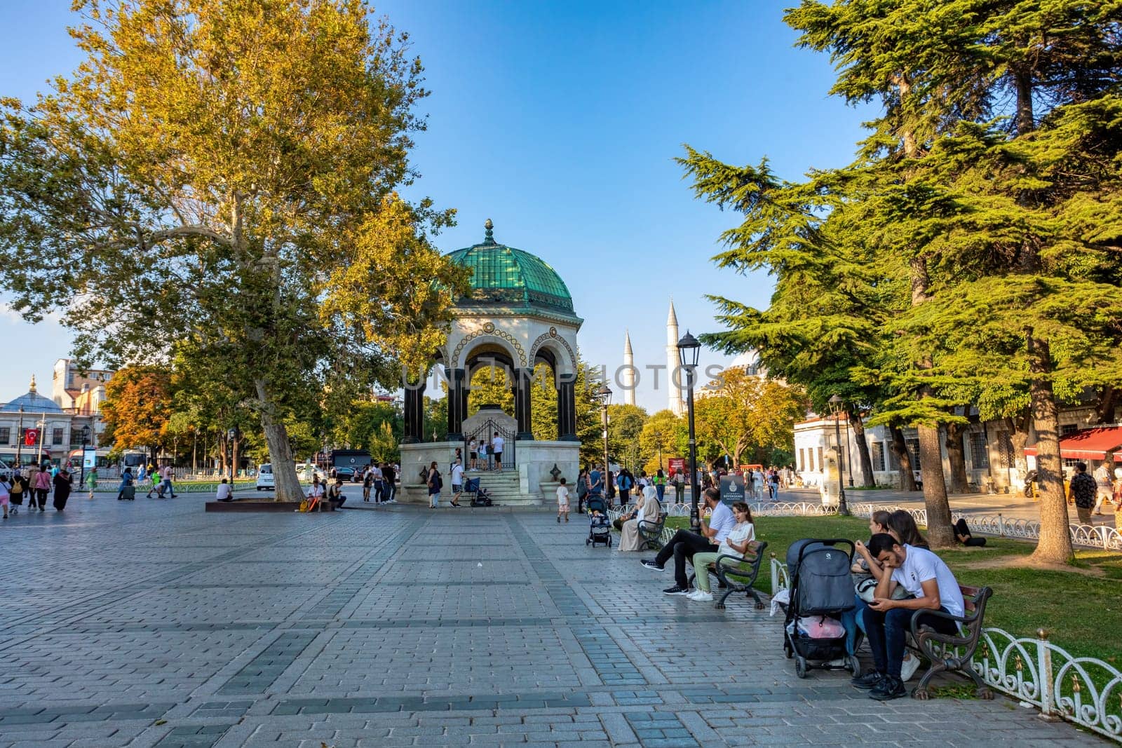 Istanbul, Turkey - August 5, 2022: View of people resting in Sultan Ahmed Blue Mosque park Istanbul, Turkey