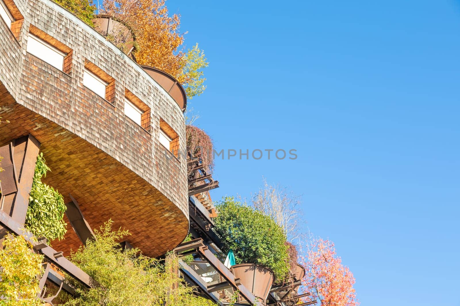 Turin, Italy - Circa November 2021: real estate green residential building. Exterior with modern design, plants and wood integrated. This Treehouse Suite is named 25 Verde