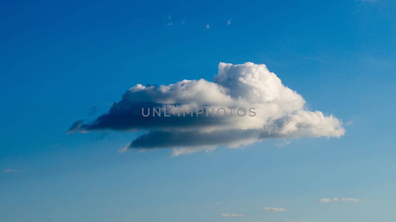 Clouds illuminated by the sun in the sky as background. Background image for further editing