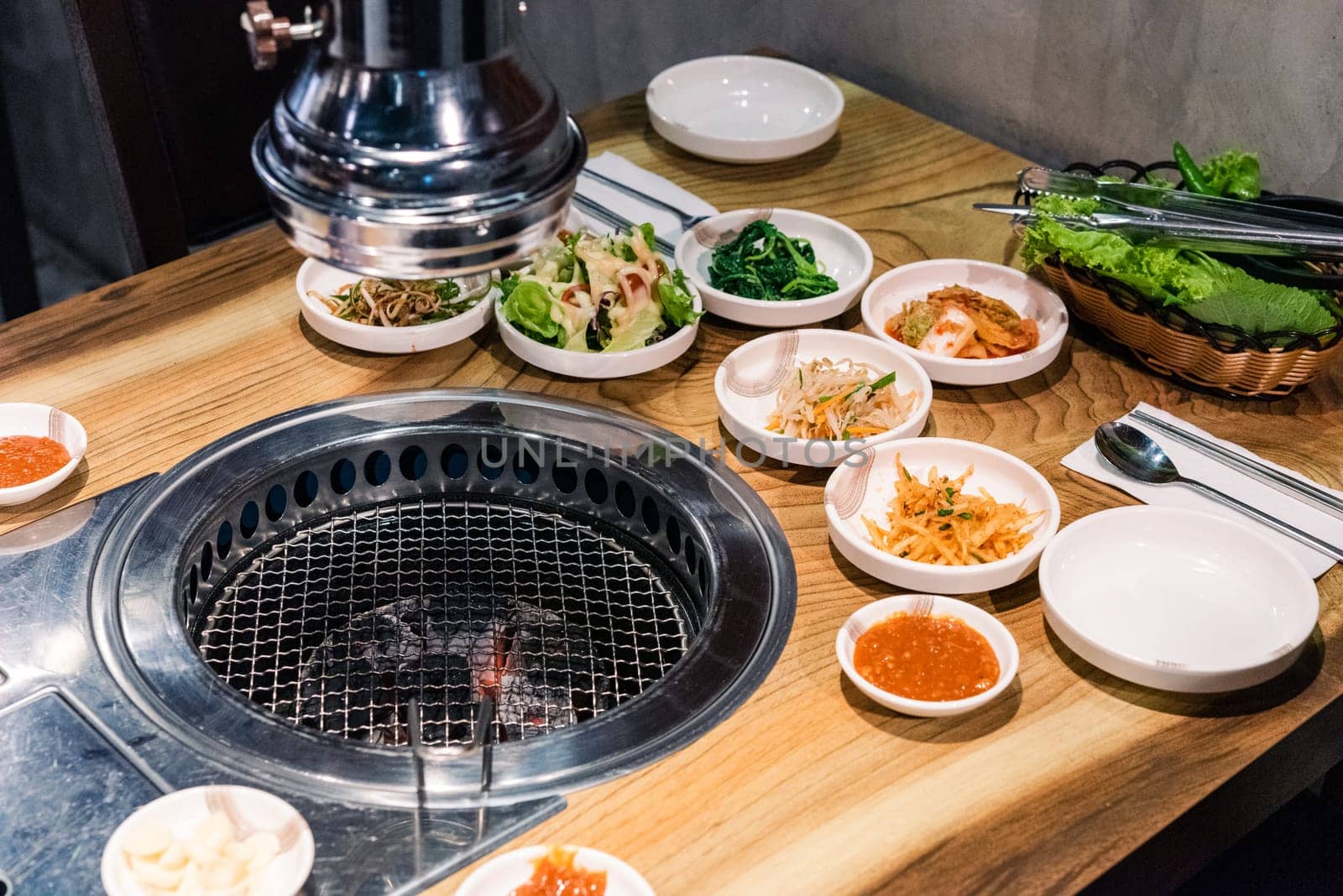 Spicy Kimchi group. Korean pickle or Pickled radish vegetables set and seasoning on bowl on stove serve wood table background, Japanese food