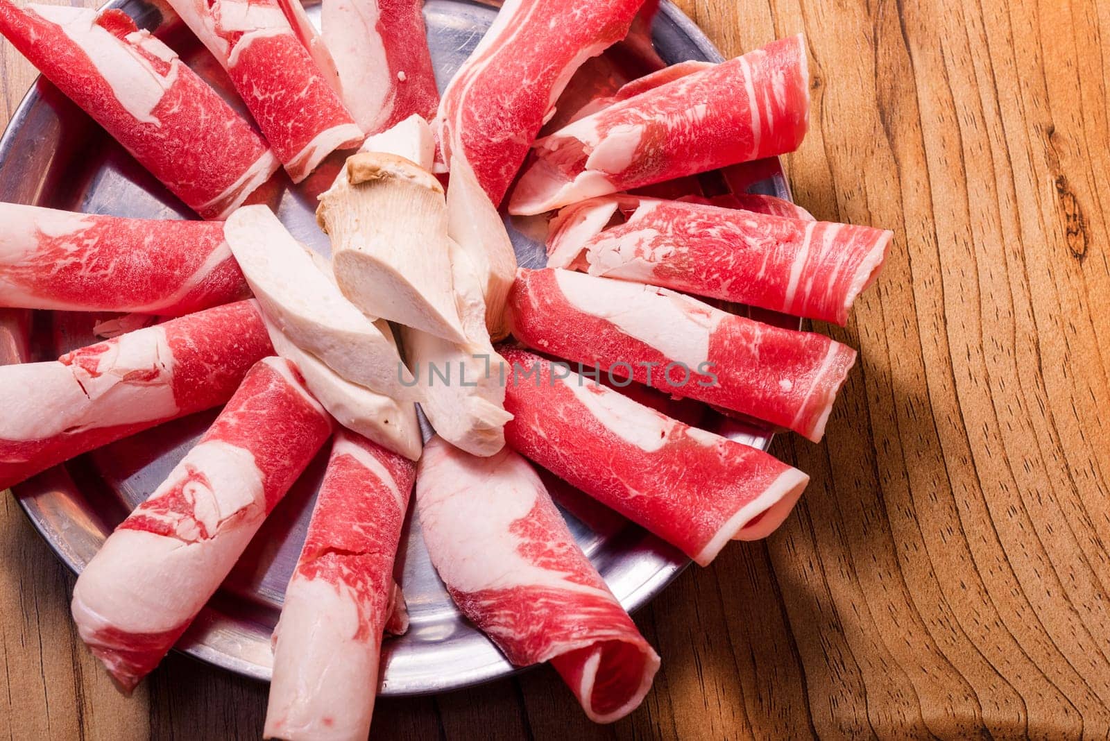Raw pork on plate, Korean traditional style fresh pork beef belly BBQ, Japanese meat hot pot or Shabu in the restaurant, barbecue food