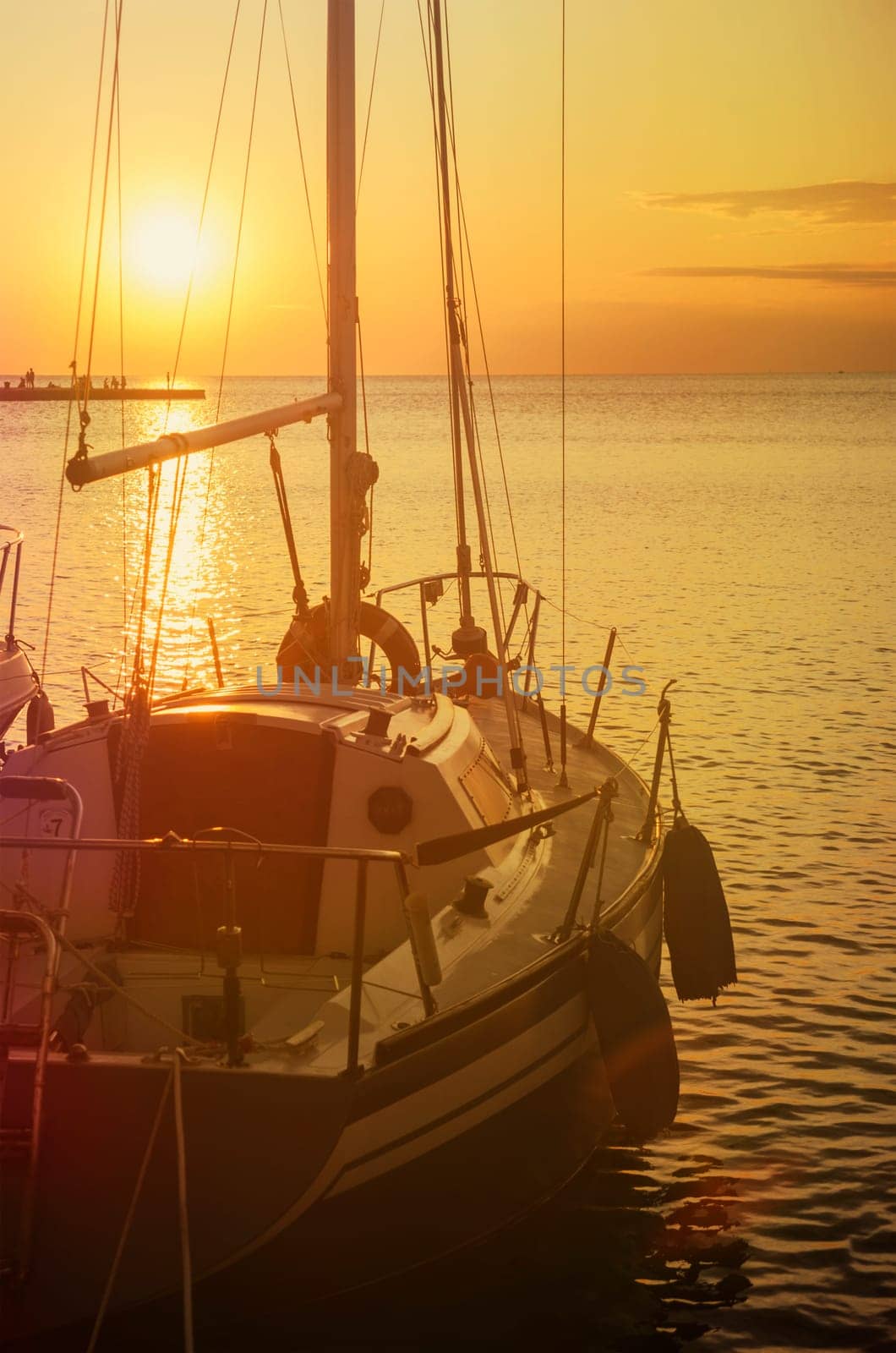 Luxury yacht in marina. Holiday traveling by sail boat at beautiful sunset in summer.