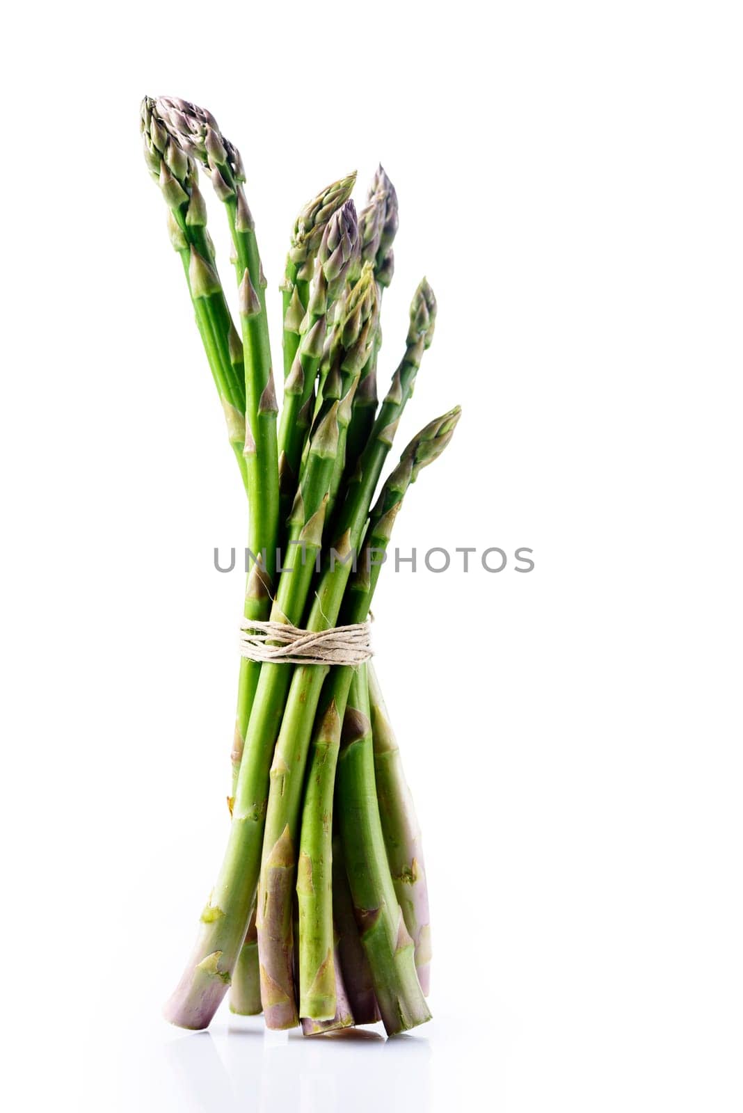 Fresh asparagus isolated on white background. Healthy eating and vegetarian cooking concept.