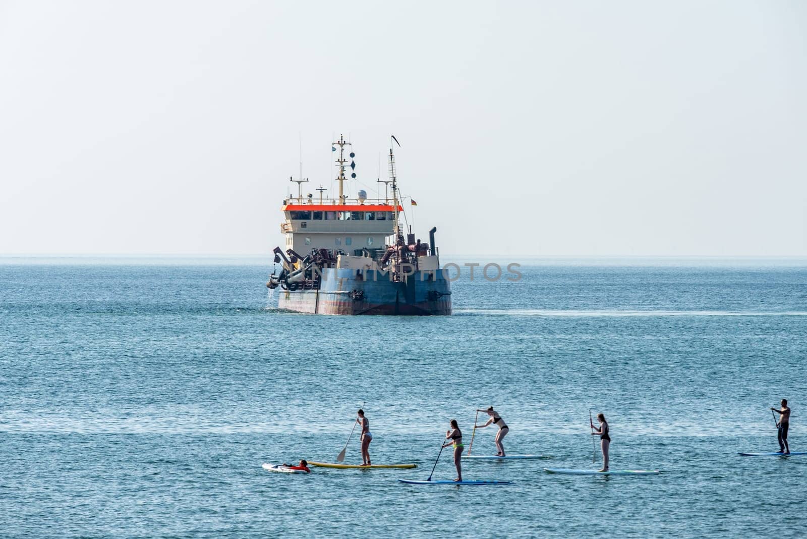 Stand-up paddlers on the North Sea coast