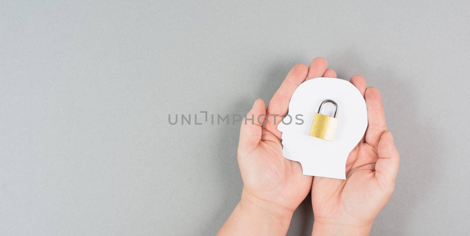 Silhouette of a head with a lock, lockout from computer cloud, safety concept, mental health, protection of thoughts and privacy