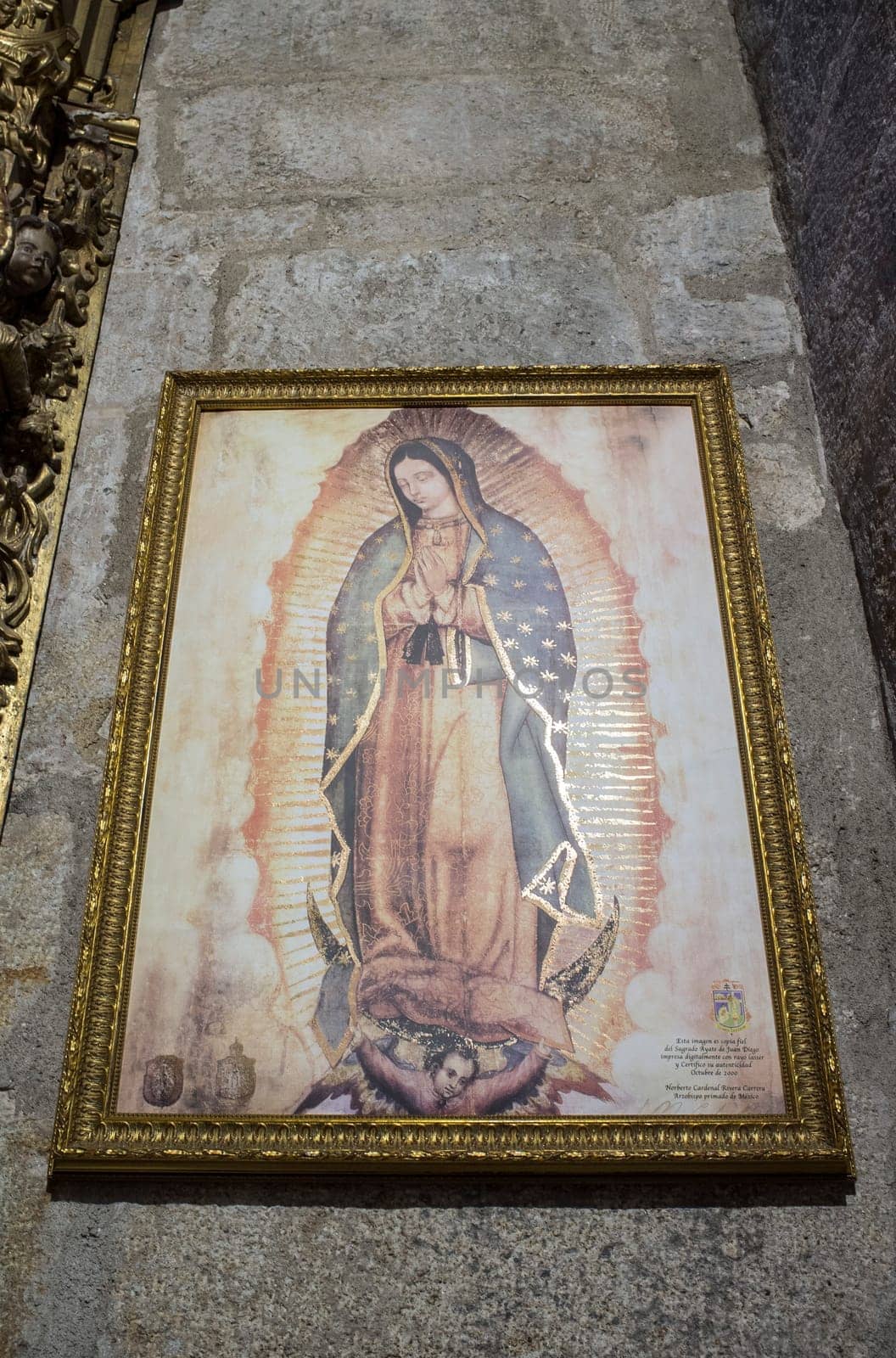 Caceres, Spain - Oct 26th, 2021: Our Lady of Guadalupe Painting, reprod. from Sagrado Ayate de Juan Diego. Church of San Juan, Caceres, Extremadura, Spain