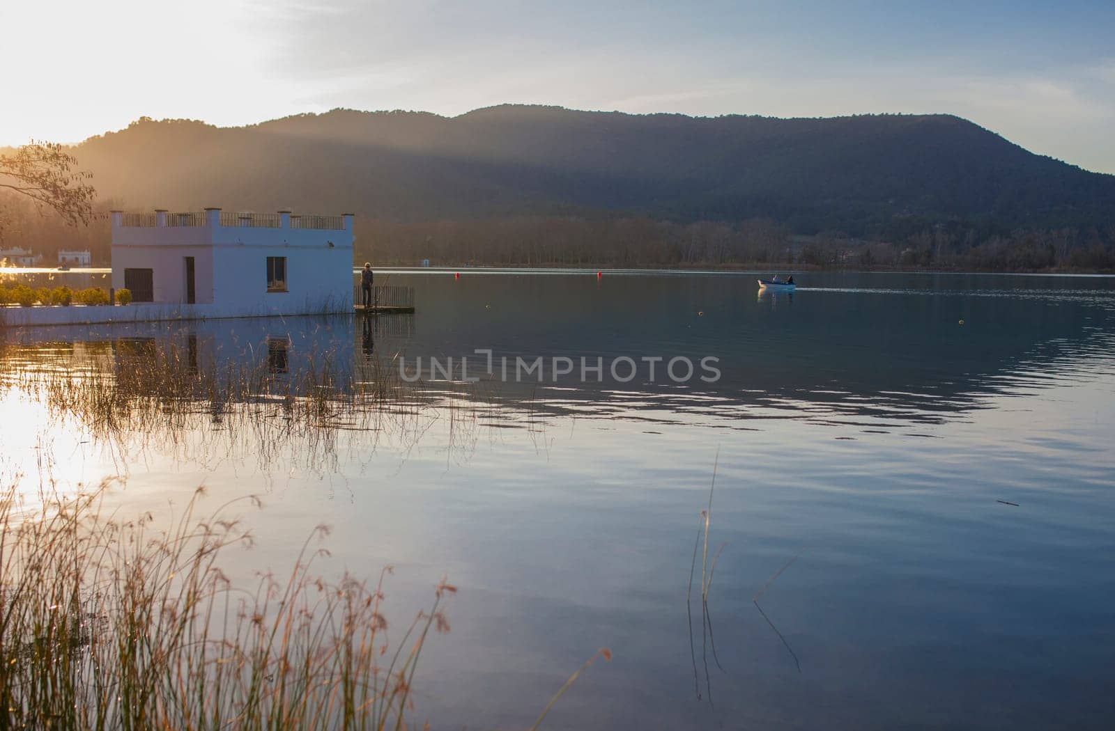 Couple rowing on boat over the Lake of Banyoles, Girona, Catalonia, Spain