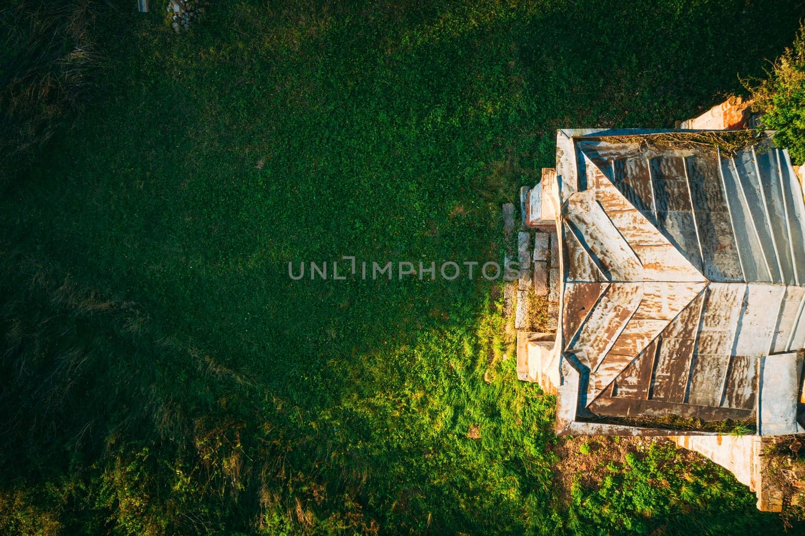 Martinovo, Beshenkovichsky District, Vitebsk Region, Belarus. Bird's-eye View Of Church Of The Intercession Of The Most Holy Theotokos. Aerial View Of Historic Landmark In Autumn Sunny Evening. Flat View.