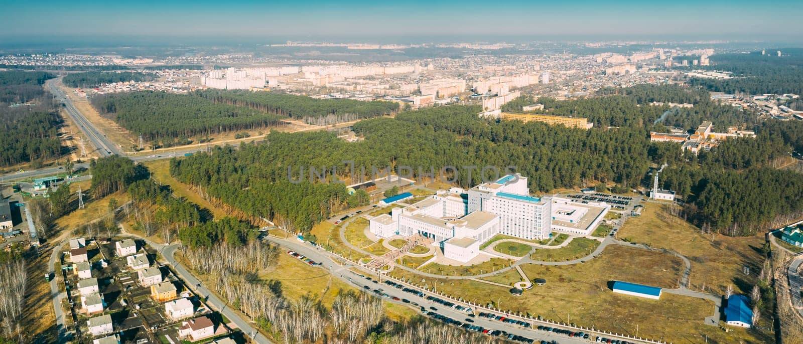 Gomel, Belarus. Aerial View OF Building Of Republican Scientific Center For Radiation Medicine And Human Ecology In Spring Sunny Day. Top View. Drone View. Bird's Eye View. Panorama.