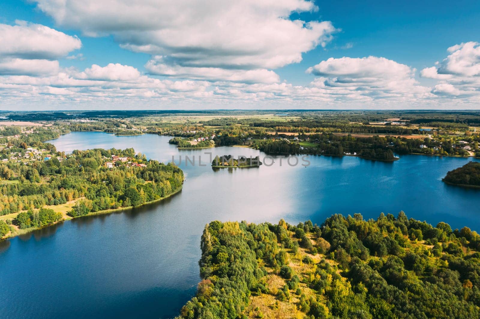 Lyepyel District, Vitebsk Region, Belarus. Aerial View Of Lyepyel Cityscape Skyline In Summer Day. Sunny Sky Above Lepel Lake. Top View Of European Nature From High Attitude In Summer. Bird's Eye View.