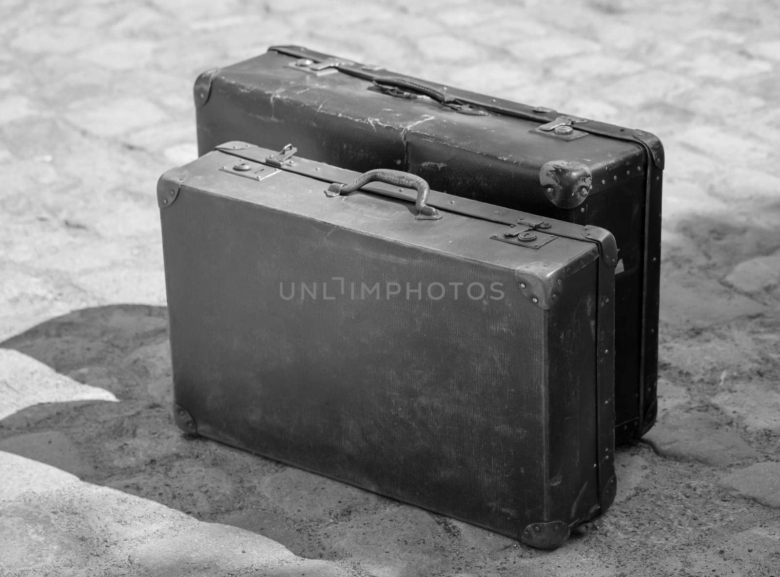 A close-up, detail shot of an old leather suitcase.