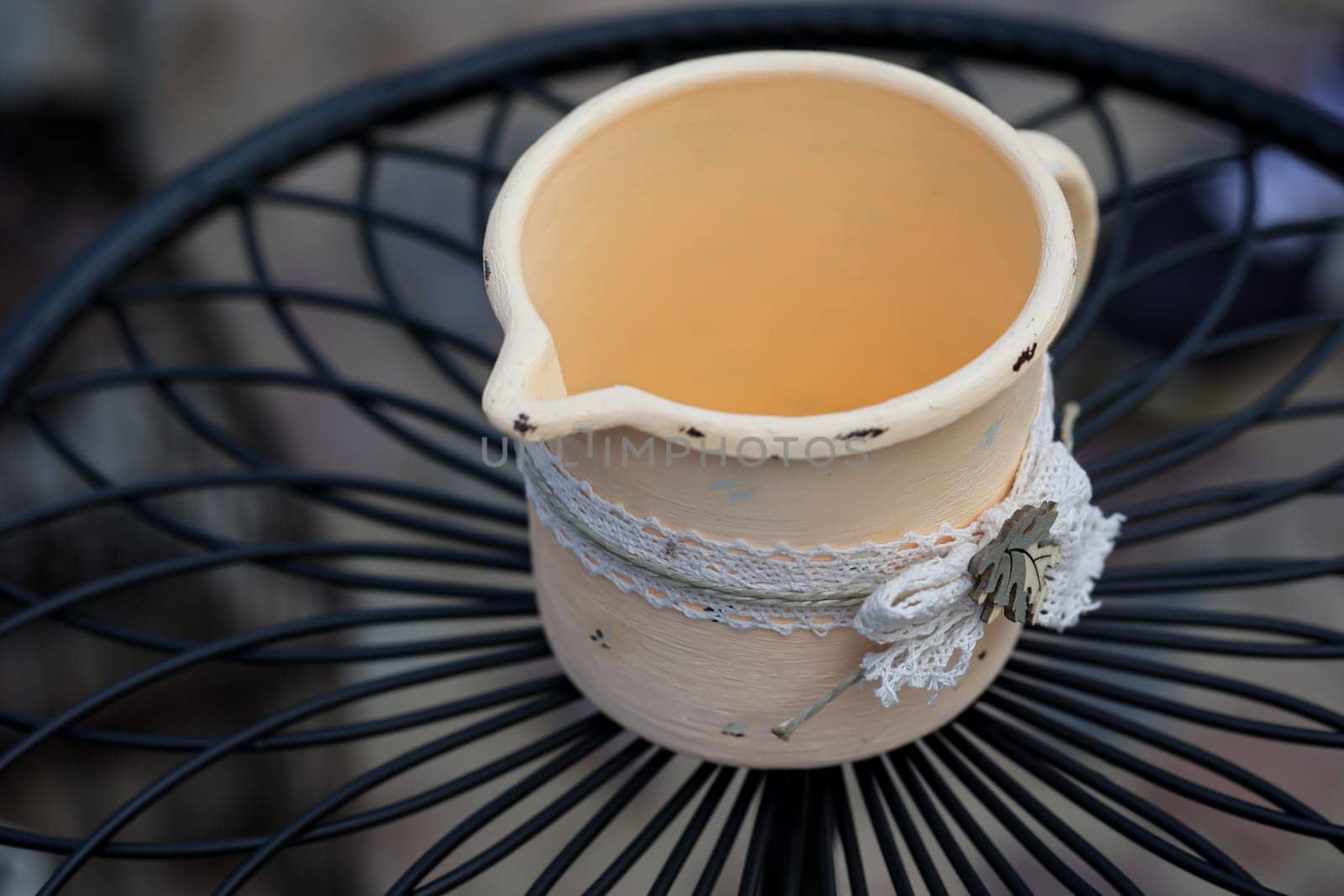 An enameled crucible, pot on a table.
