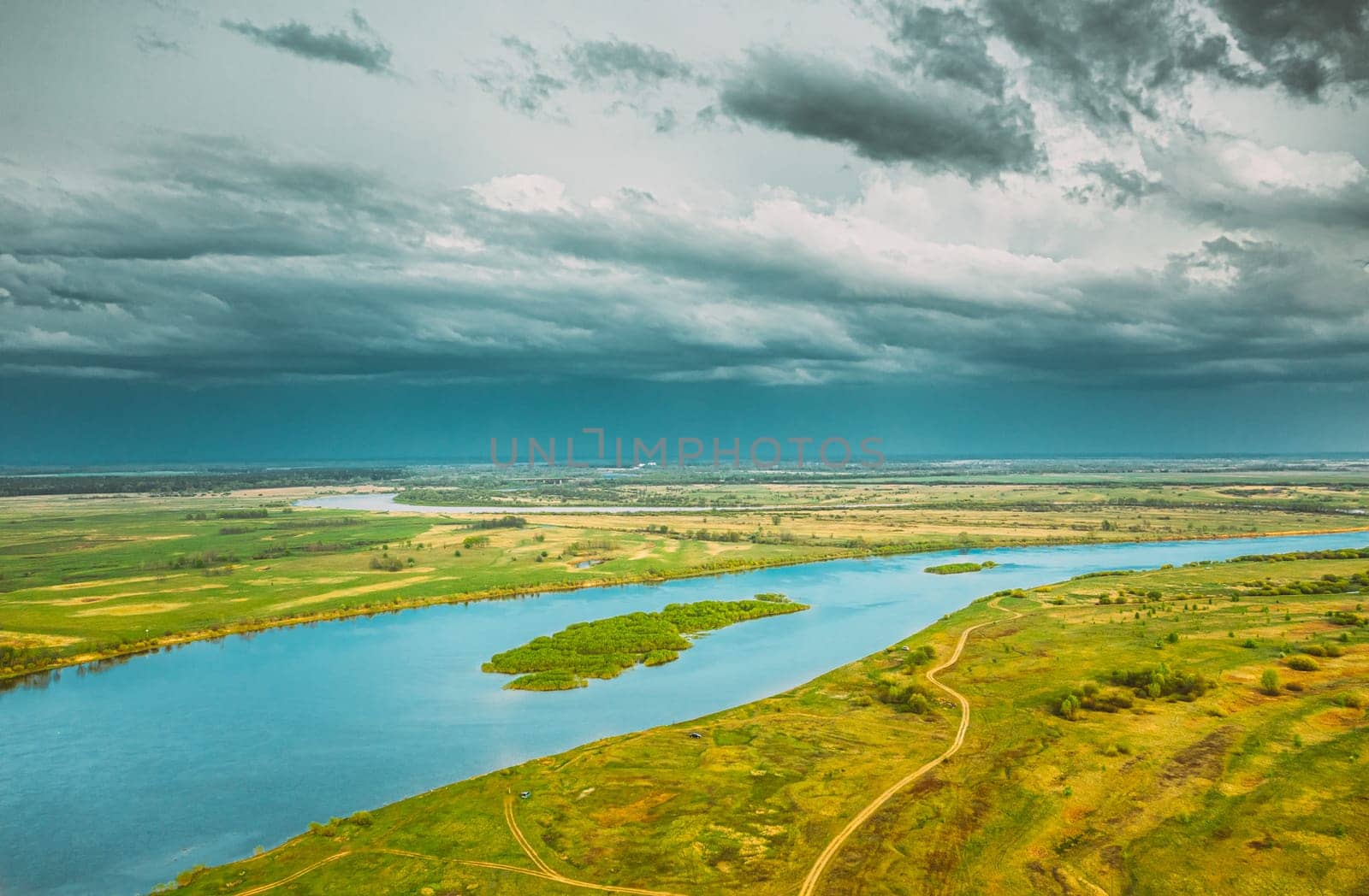 Rechytsa, Gomel Region, Belarus. Aerial View Of Dnieper River. Sky Above Green Meadow And River Landscape. Top View Of European Nature From High Attitude In Summer. Bird's Eye View.