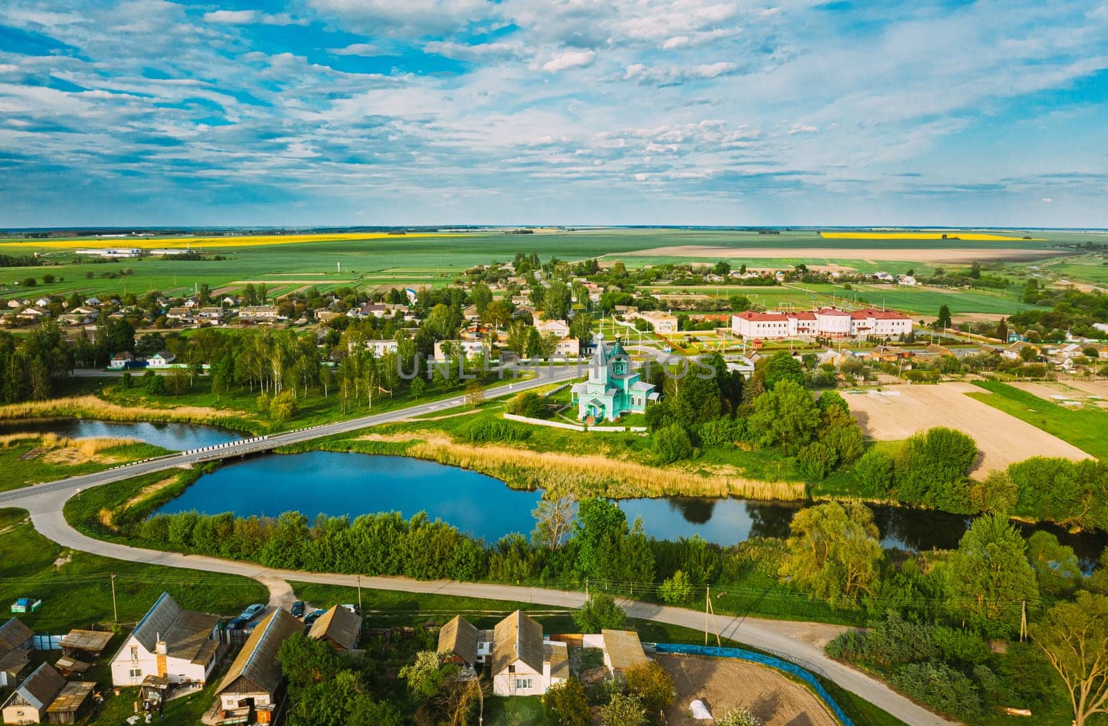 Krupets, Dobrush District, Gomel Region, Belarus. Aerial View Of Old Wooden Orthodox Church Of The Holy Trinity At Sunny Summer Day.