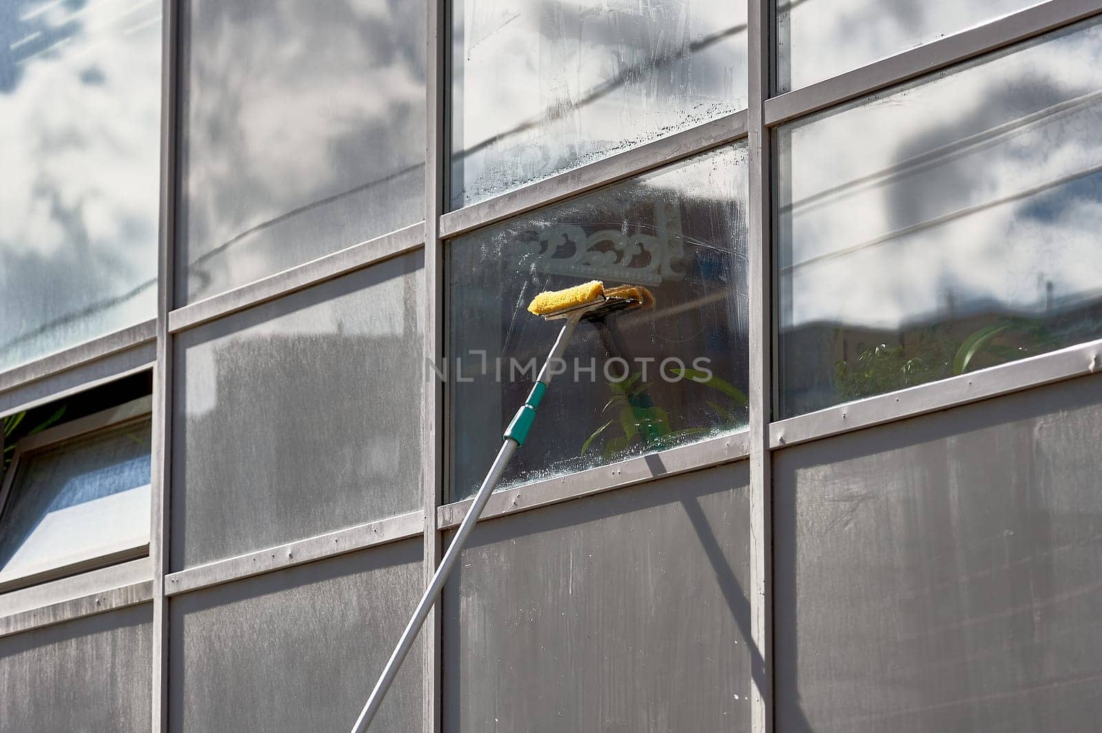 window washing, washing a street shop window. High quality photo