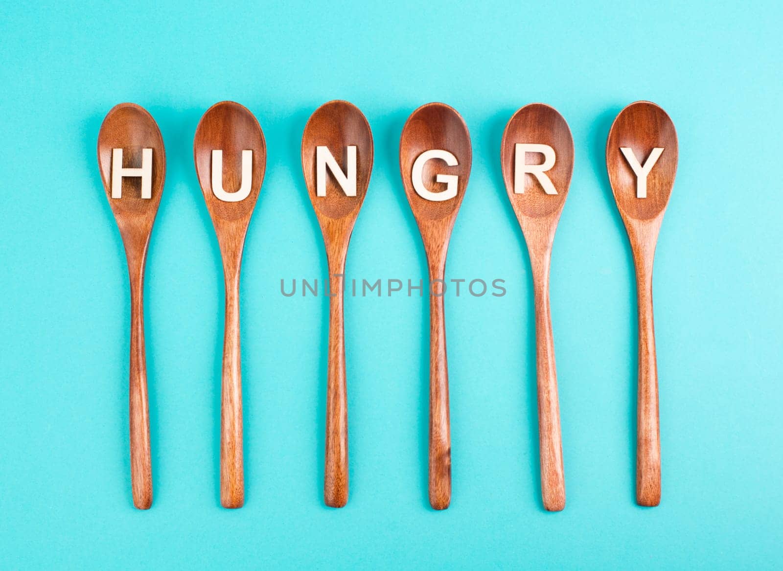 Hungry is standing on the wooden spoons, food shortage and starving because of the war and inflation, political issue