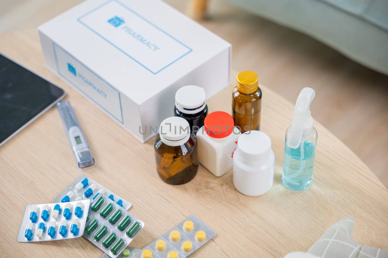 Home medicine with medicine package box free first aid kit with pills from pharmacy hospital delivery service at home on table in living room,  online purchase delivery of medicines to your home