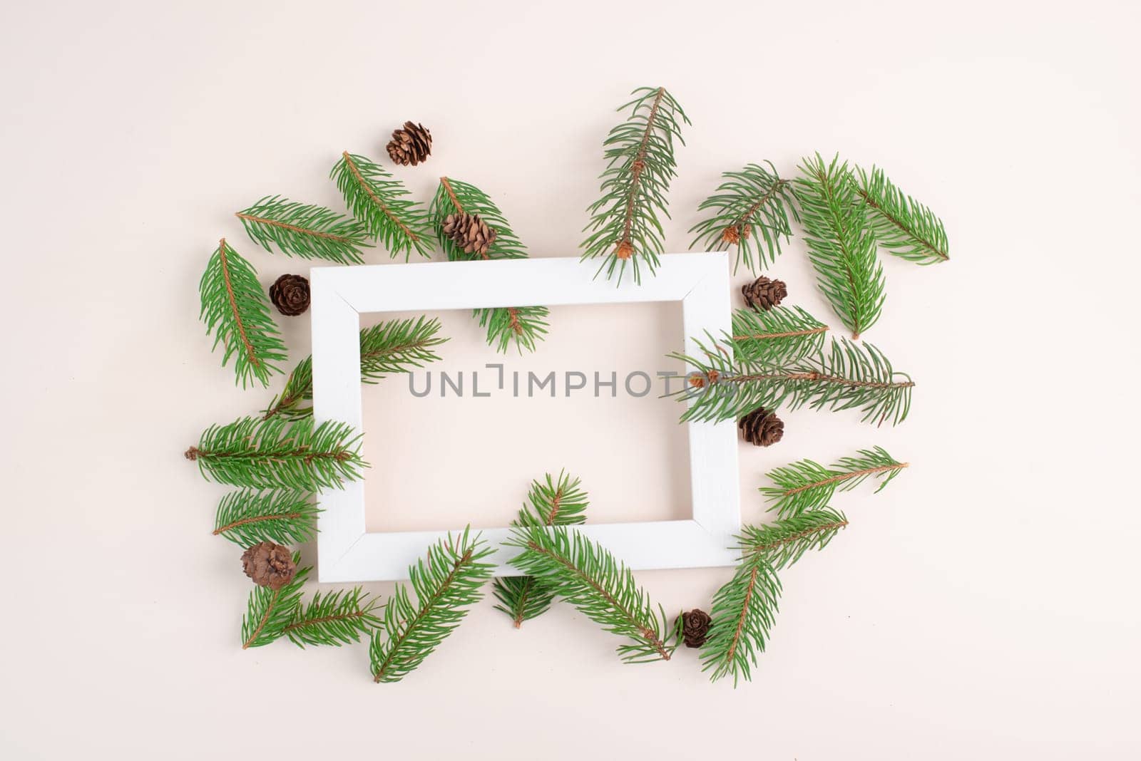 Christmas holiday background, frame with fir branches and cones, winter season greeting card with copy space