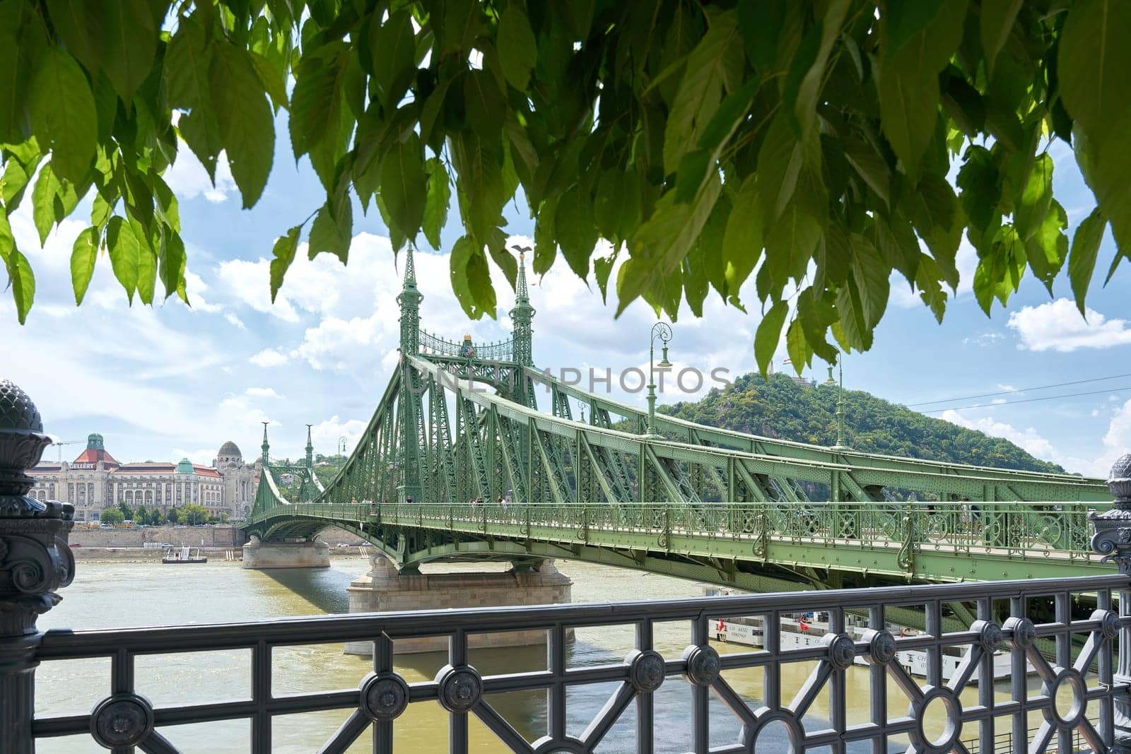The hostoric Freedom Bridge, Szabadsag hid, in Budapest crosses the Danube River and connects the districts of Buda and Pest