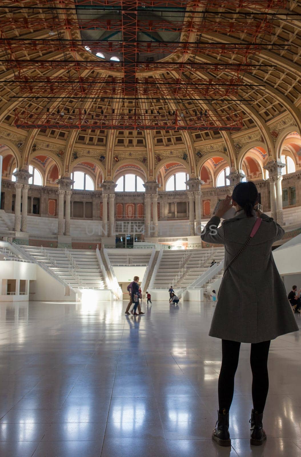 Barcelona, Spain - Dec 26th 2019: Tourist taking pictures to Great Hall of Palau Nacional building. Barcelona, Spain