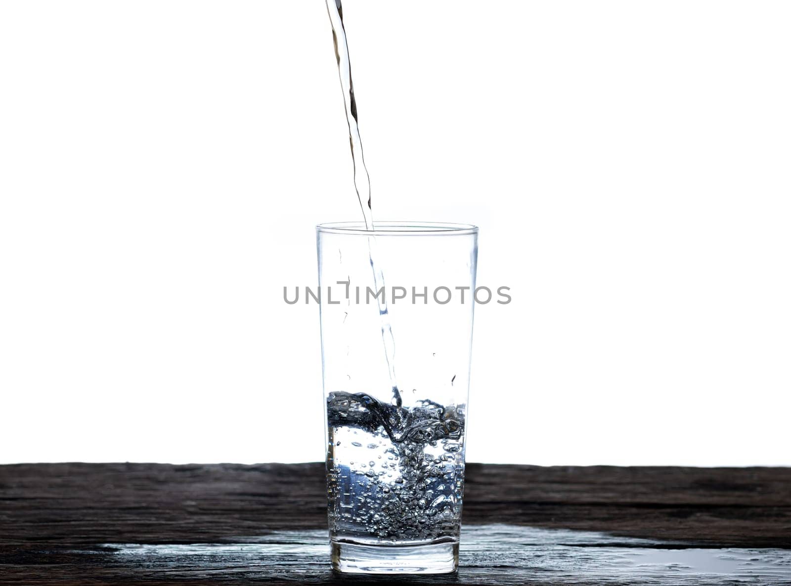The image of pouring drinking water, into a glass, that makes one feel refreshed isolated on white background, Splashing water, Sparkling water