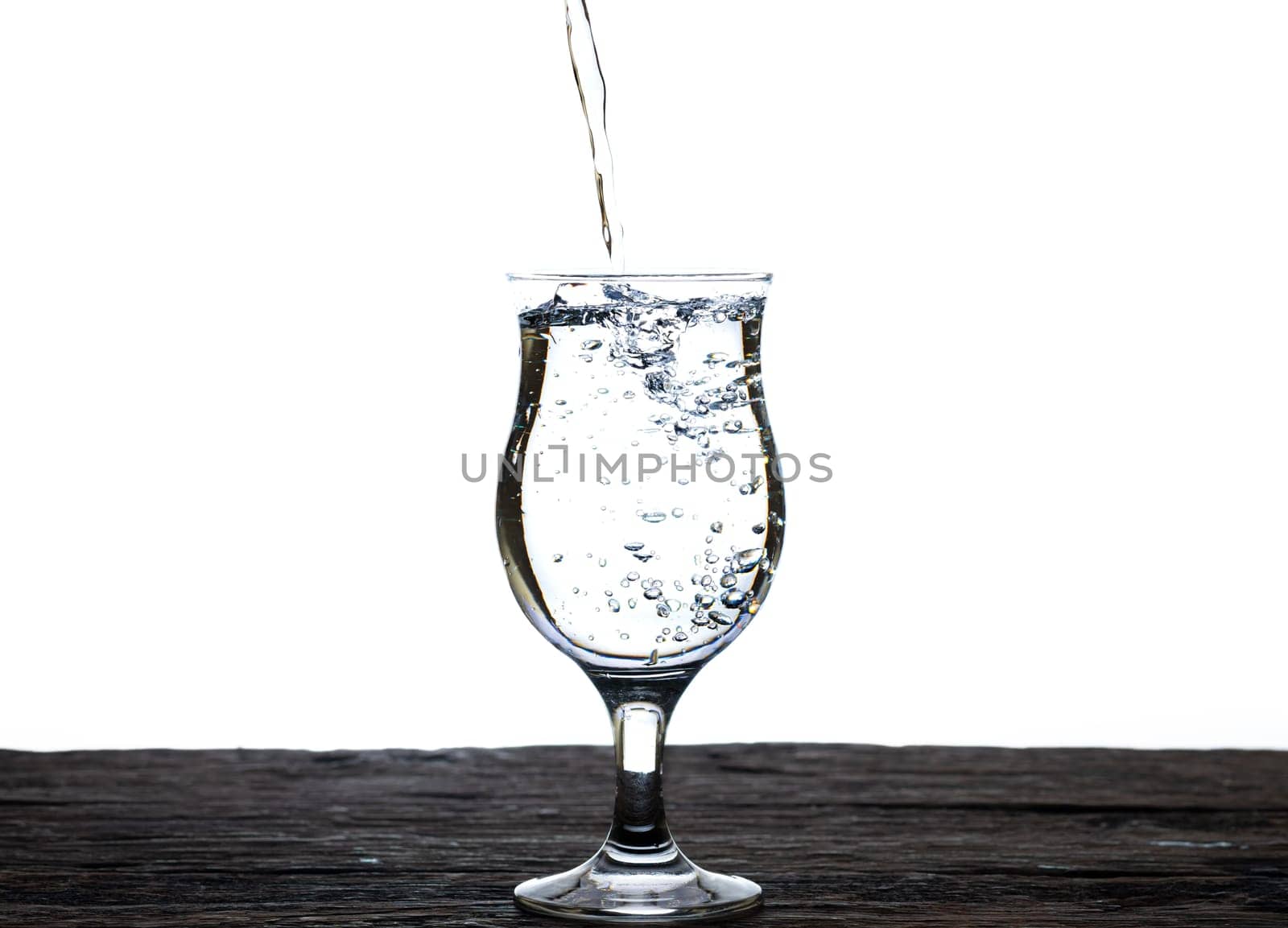 The image of pouring drinking water, into a glass, that makes one feel refreshed isolated on white background, Splashing water, Sparkling water