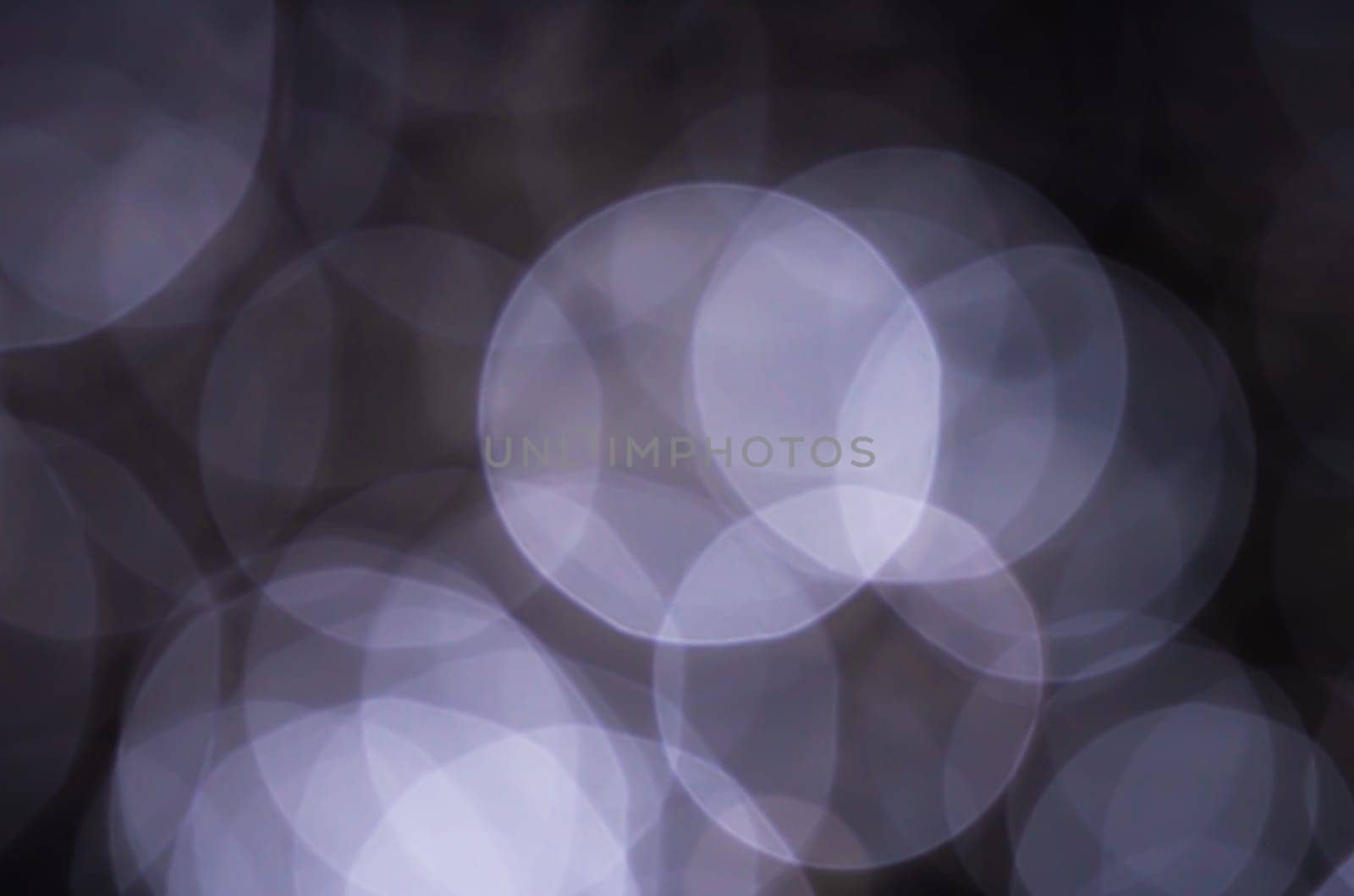 Light abstract dark bokeh christmas circle color glitter blurred black background