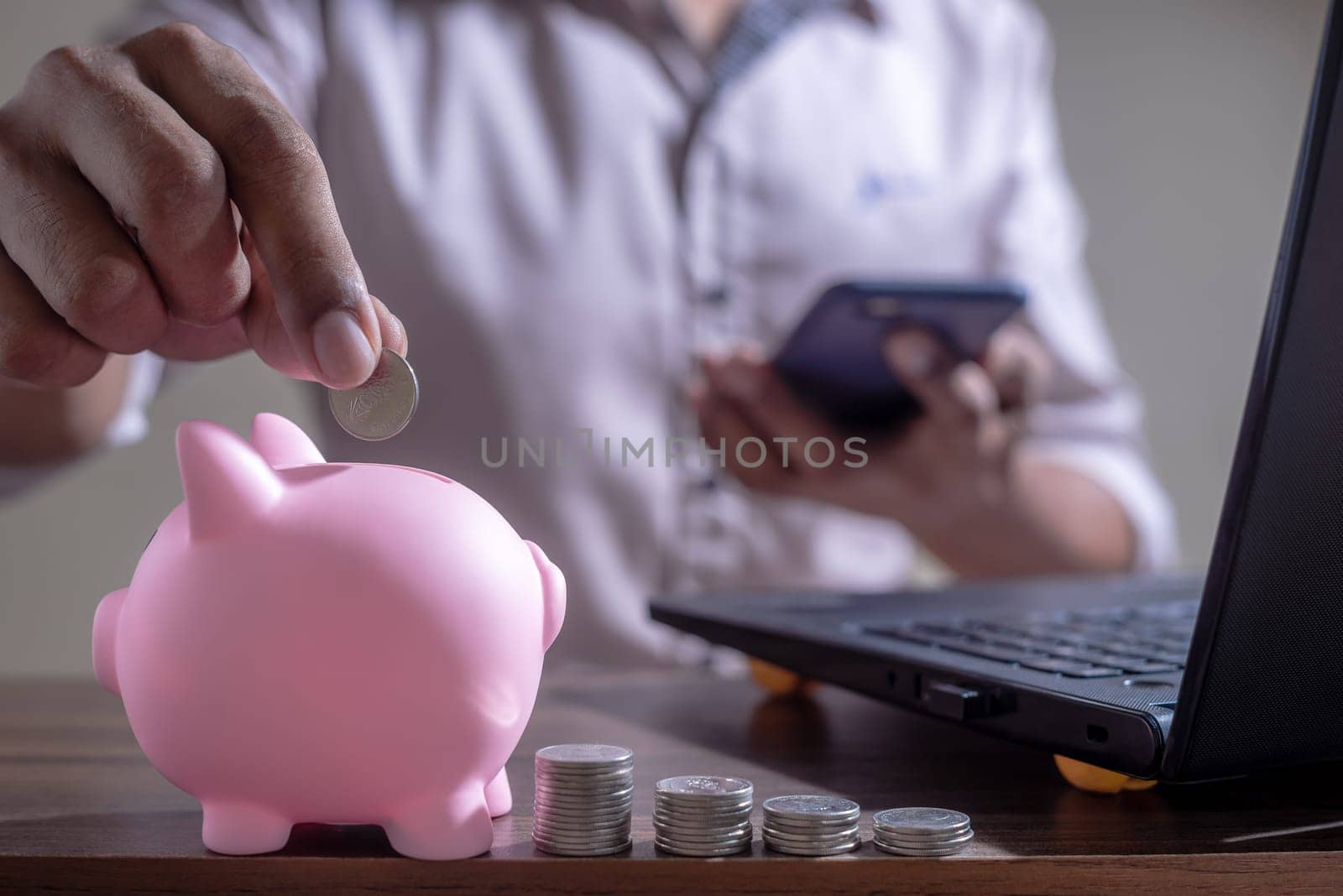 Save money and account banking for finance concept, Piggy bank with coin on blurred background, Save Monney for Investors Using Internet to Trade Stocks or Trade Fund