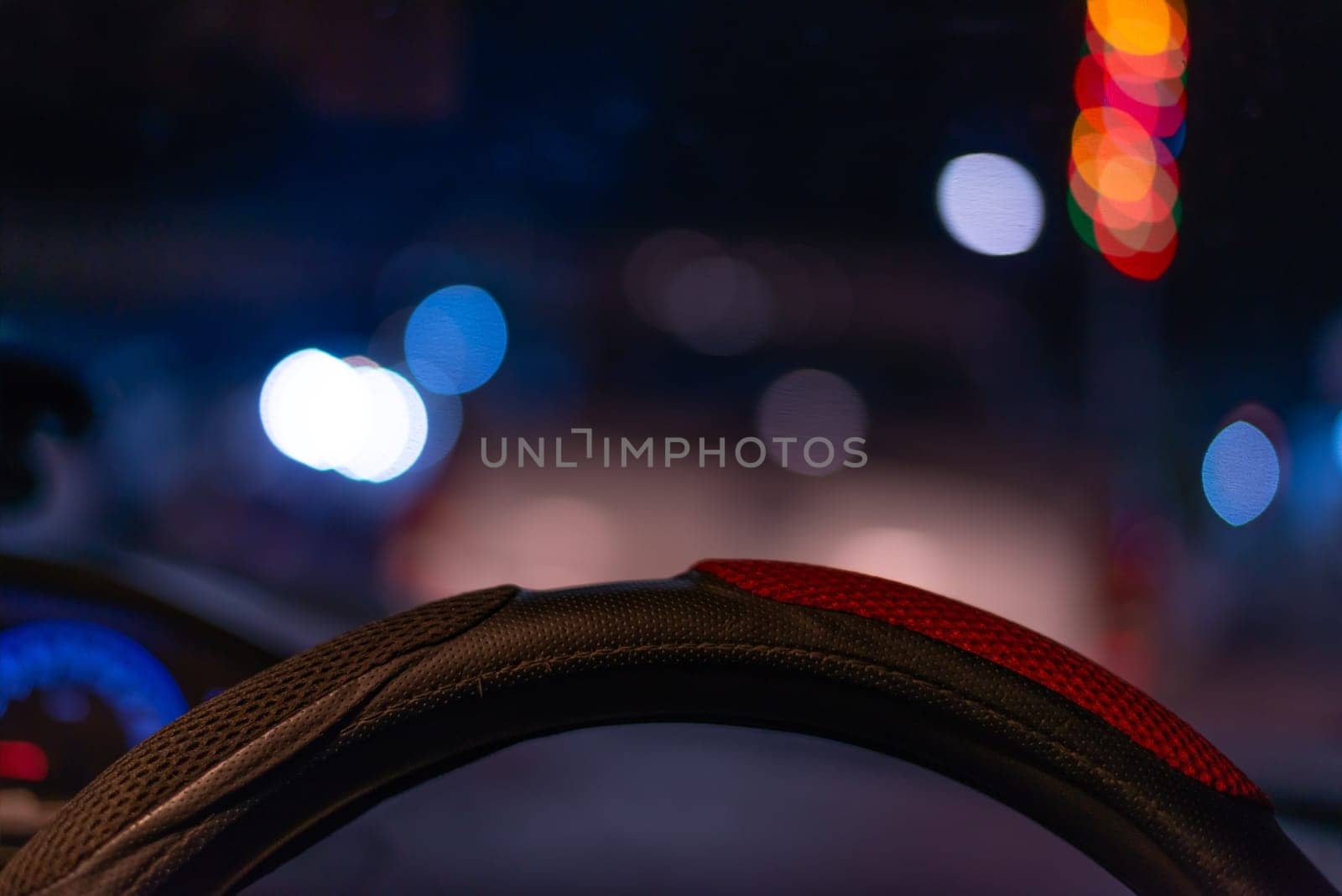 Driving car concept, Driving a car on the road in night city time blurred light bokeh background