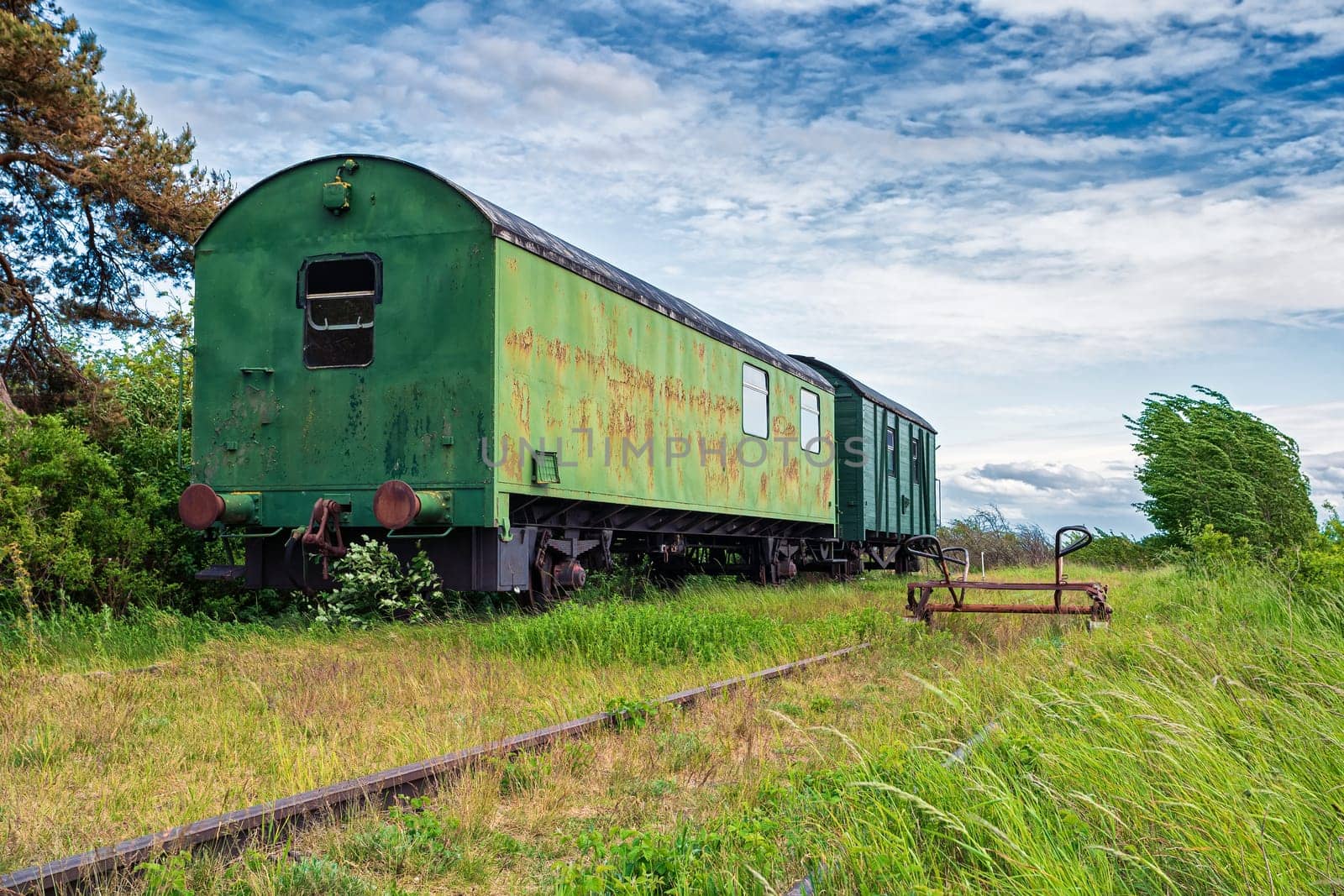 old wagons and tracks on the former railway line to Fischland-Darss peninsula, Bresewitz, Mecklenburg-Western Pomerania, Germany