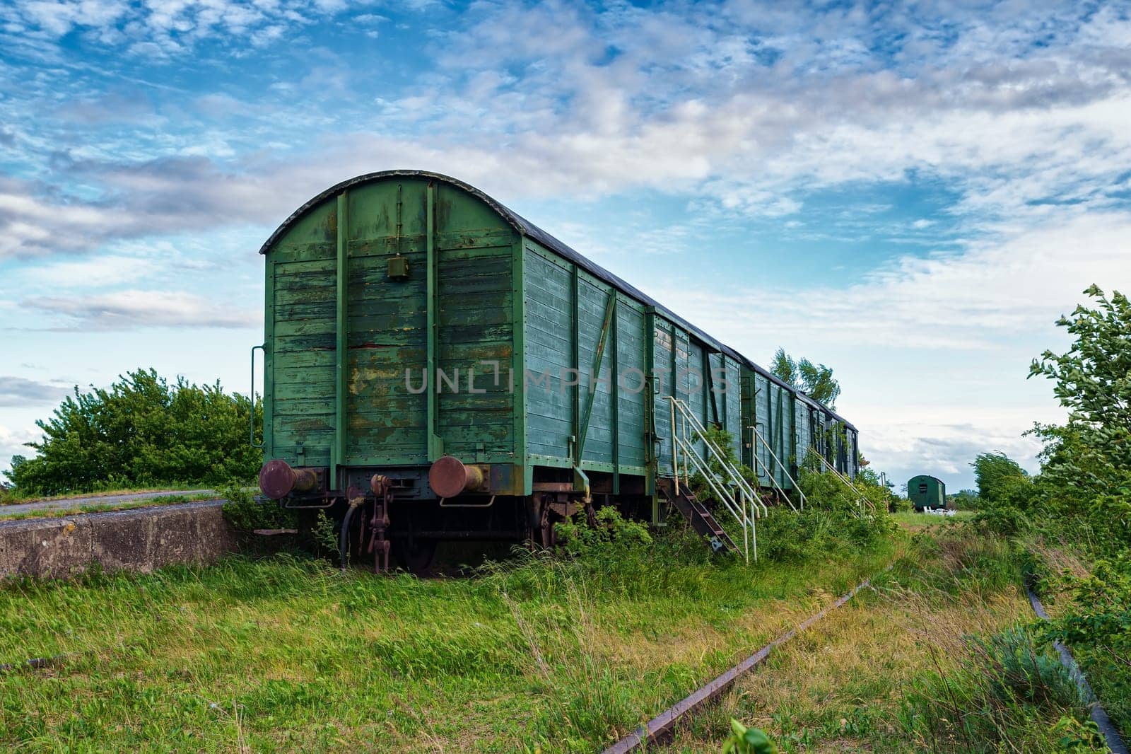 old wagons and tracks on the former railway line to Fischland-Darss peninsula, Bresewitz, Mecklenburg-Western Pomerania, Germany